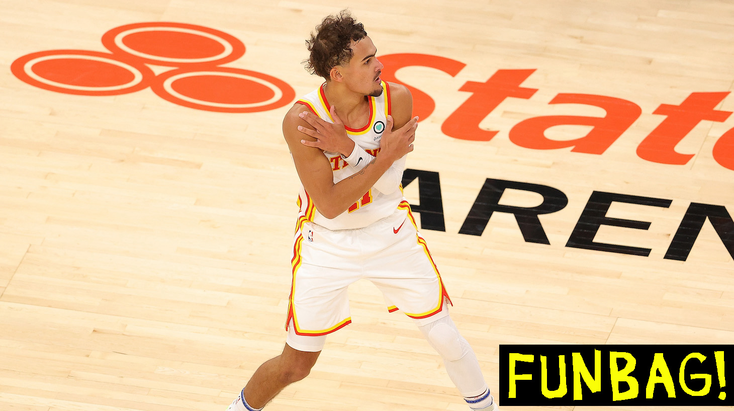 ATLANTA, GEORGIA - JANUARY 20: Trae Young #11 of the Atlanta Hawks reacts after hitting a three-point basket in the final seconds of their 123-115 win over the Detroit Pistons during overtime at State Farm Arena on January 20, 2021 in Atlanta, Georgia. NOTE TO USER: User expressly acknowledges and agrees that, by downloading and or using this photograph, User is consenting to the terms and conditions of the Getty Images License Agreement. (Photo by Kevin C. Cox/Getty Images)