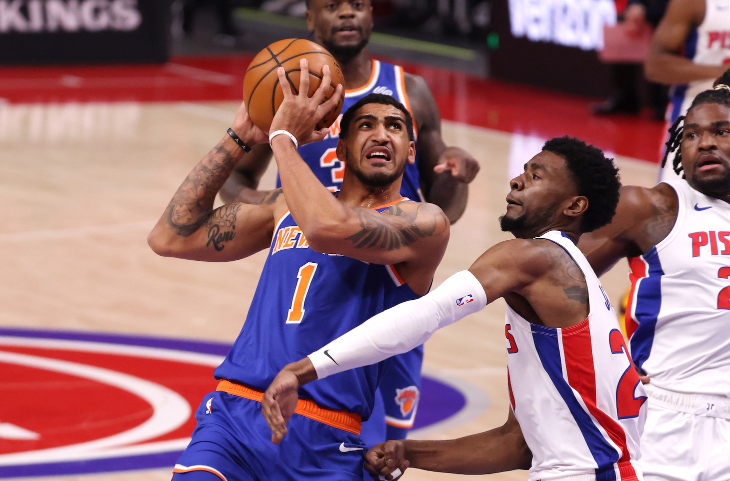 DETROIT, MICHIGAN - FEBRUARY 28: Obi Toppin #1 of the New York Knicks drives to the basket against Josh Jackson #20 of the Detroit Pistons during the first half at Little Caesars Arena on February 28, 2021 in Detroit, Michigan. NOTE TO USER: User expressly acknowledges and agrees that, by downloading and or using this photograph, User is consenting to the terms and conditions of the Getty Images License Agreement. (Photo by Gregory Shamus/Getty Images)