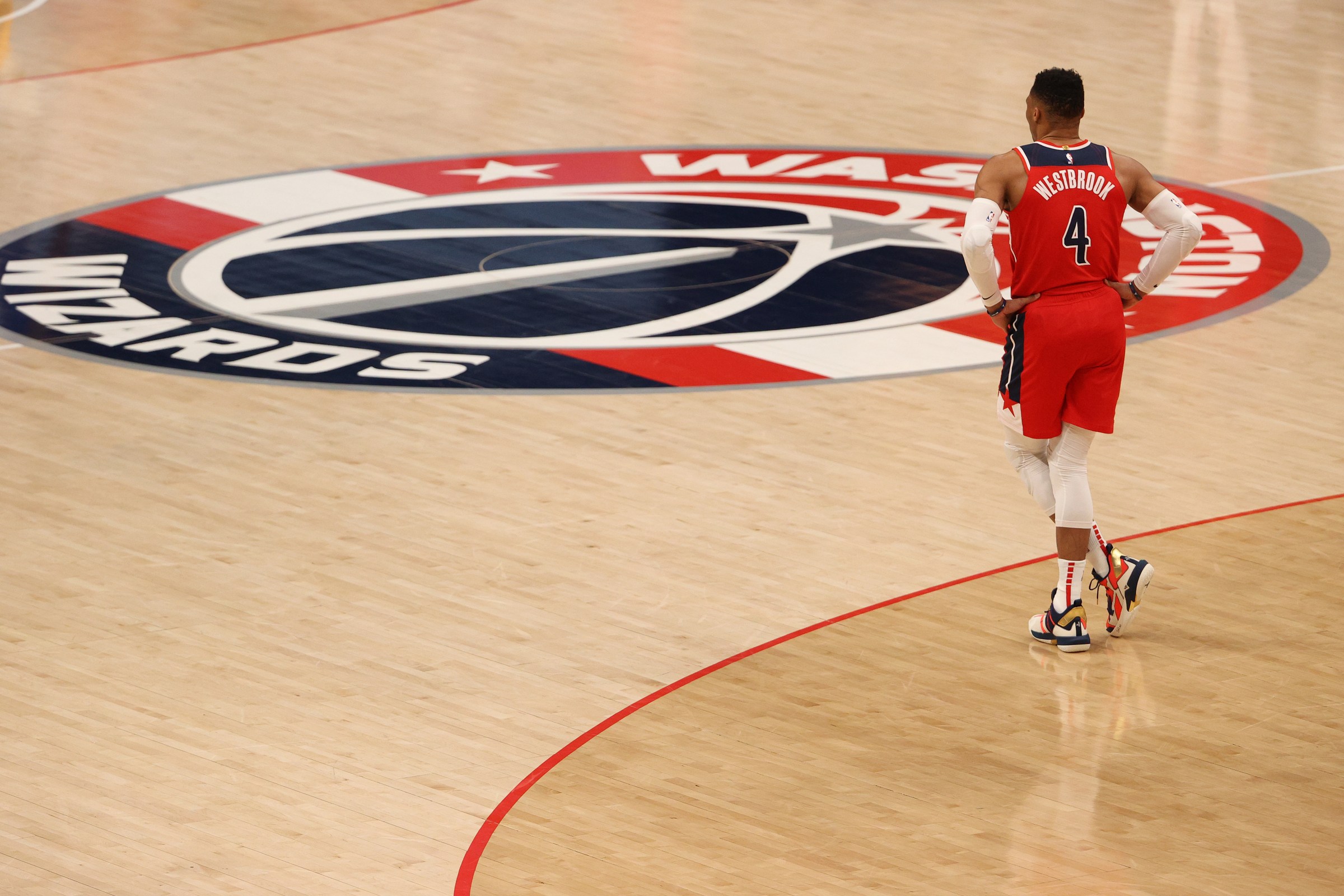 Russell Westbrook walks toward the center court logo during another Wizards loss.