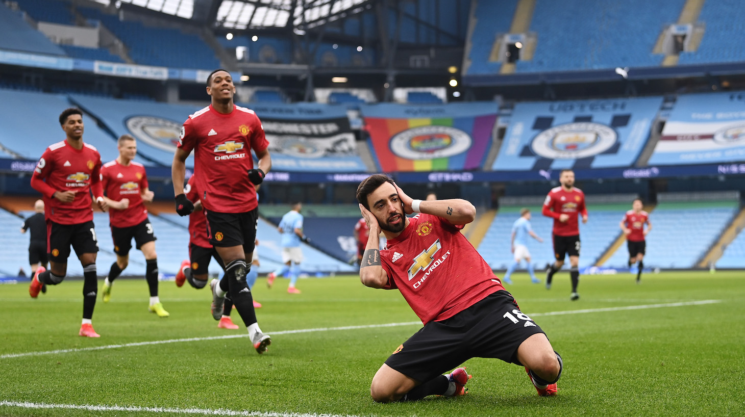 Bruno Fernandes of Manchester United celebrates after scoring their side's first goal from the penalty spot during the Premier League match between Manchester City and Manchester United at Etihad Stadium on March 07, 2021 in Manchester, England.