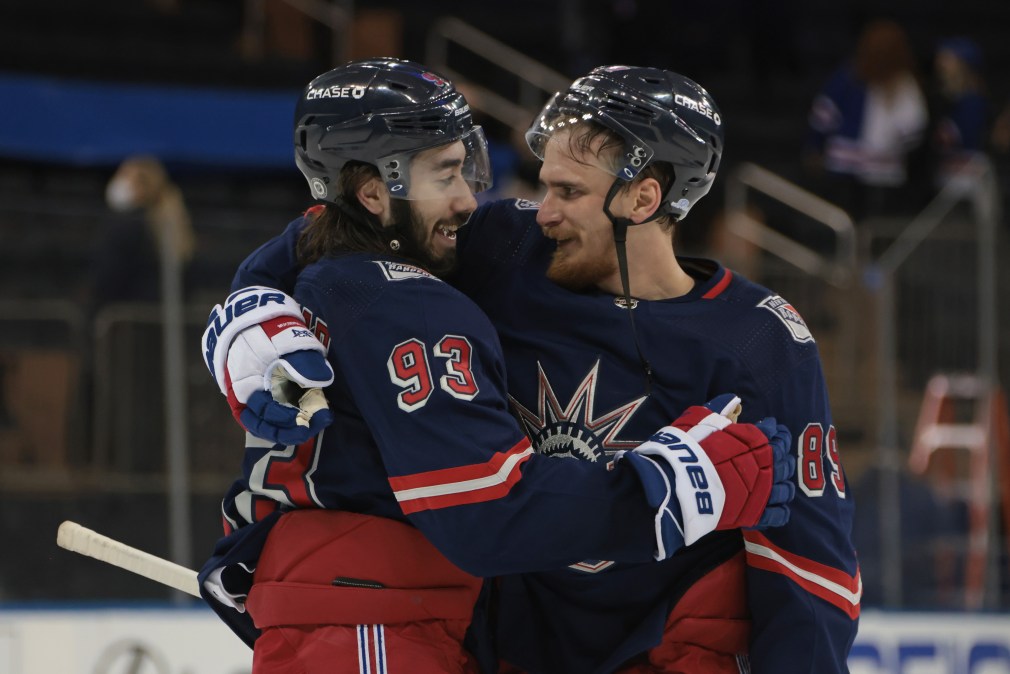 Mika Zibanejad #93 and Pavel Buchnevich #89 of the New York Rangers