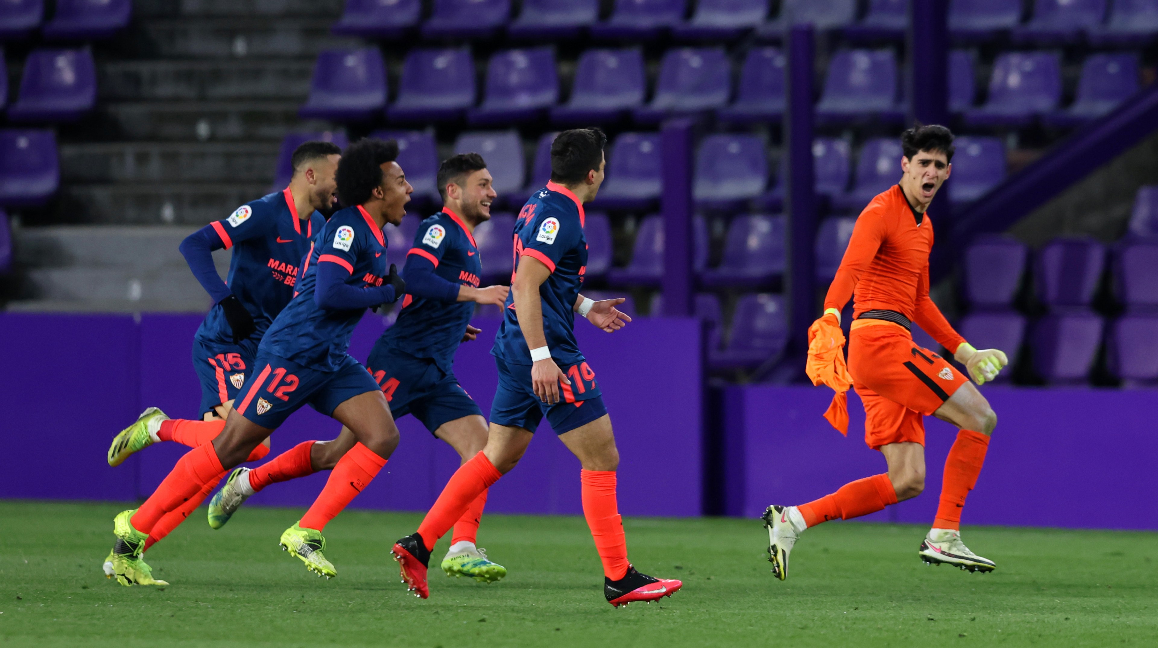 Yassine Bounou of Sevilla FC celebrates with teammates after scoring their team's first goal during the La Liga Santander match between Real Valladolid CF and Sevilla FC at Estadio Municipal Jose Zorrilla on March 20, 2021 in Valladolid, Spain.