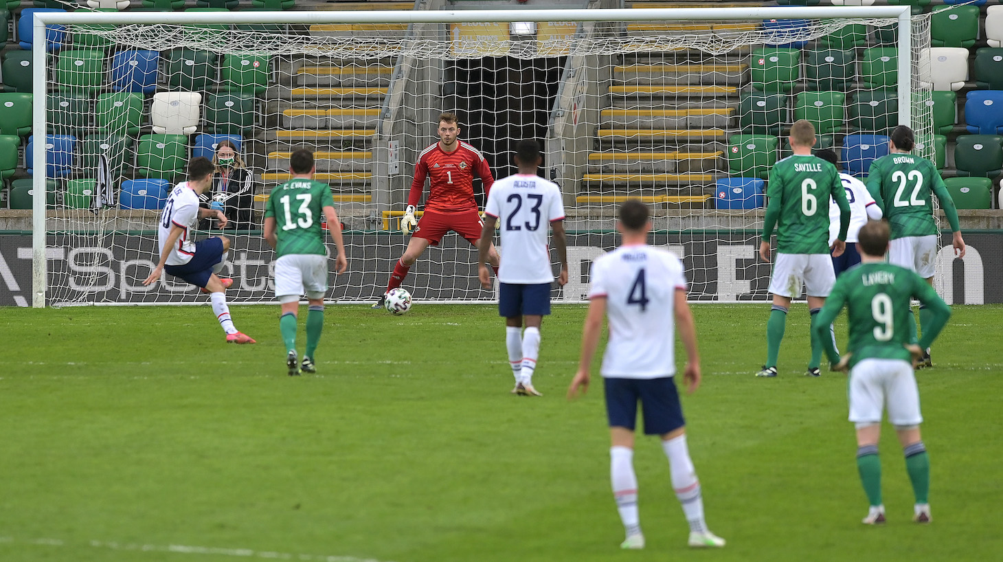 Christian Pulisic of USA scores their side's second goal past Conor Hazard of Northern Ireland during the International Friendly between Northern Ireland and USA at Windsor Park on March 28, 2021 in Belfast, Northern Ireland.