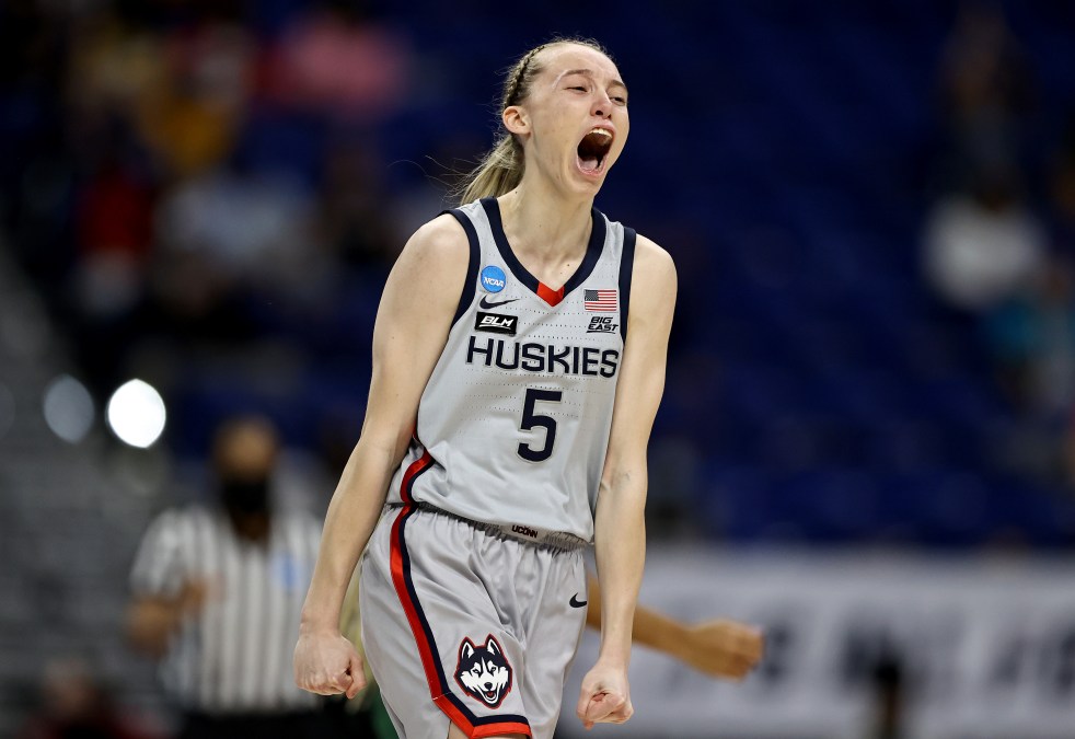 Paige Bueckers #5 of the UConn Huskies celebrates her three point basket in the first quarter against the Baylor Lady Bears during the Elite Eight round of the NCAA Women's Basketball Tournament at the Alamodome on March 29, 2021 in San Antonio, Texas.