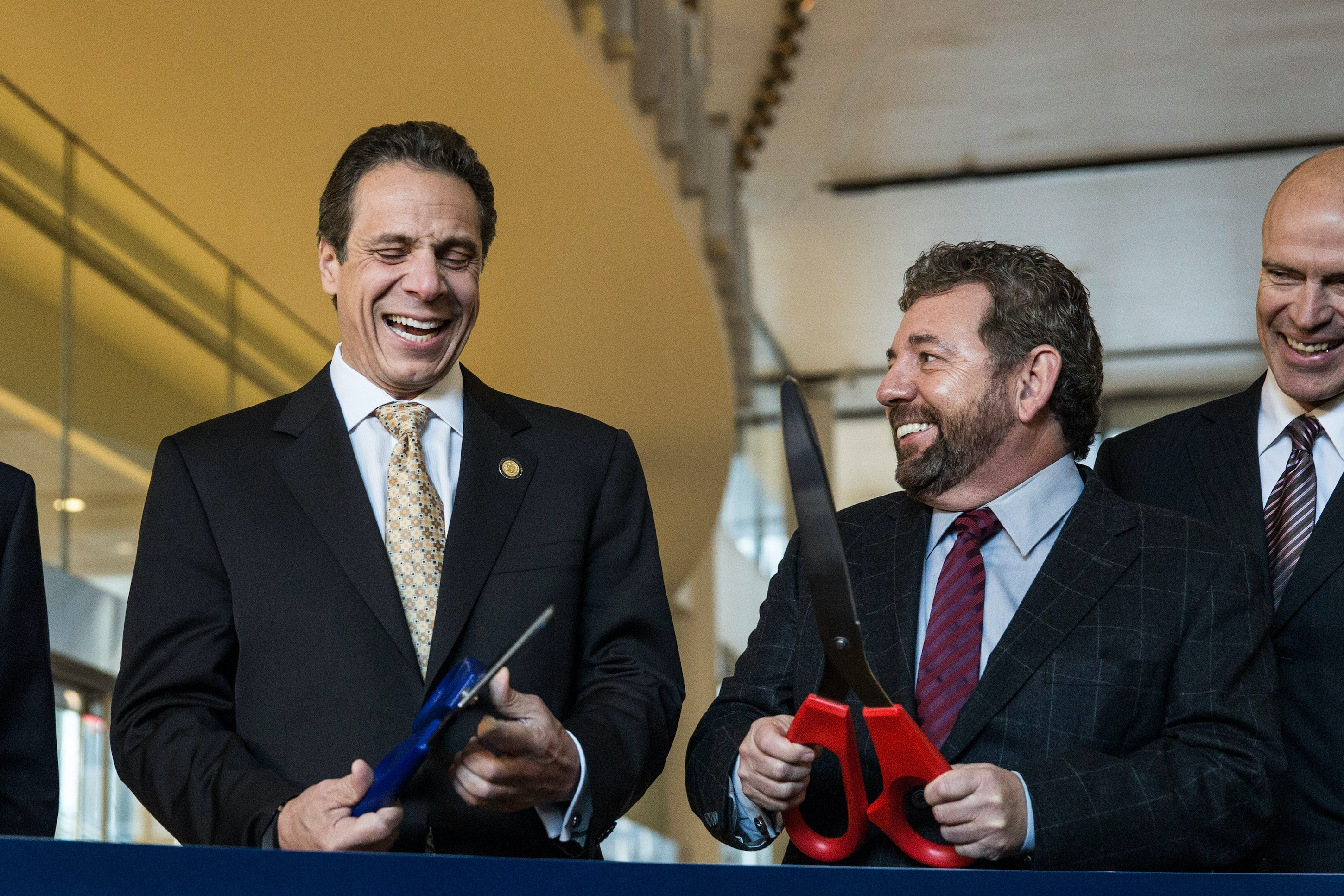 Governor Andrew Cuomo cuts a ribbon with New York Knicks owner James Dolan.