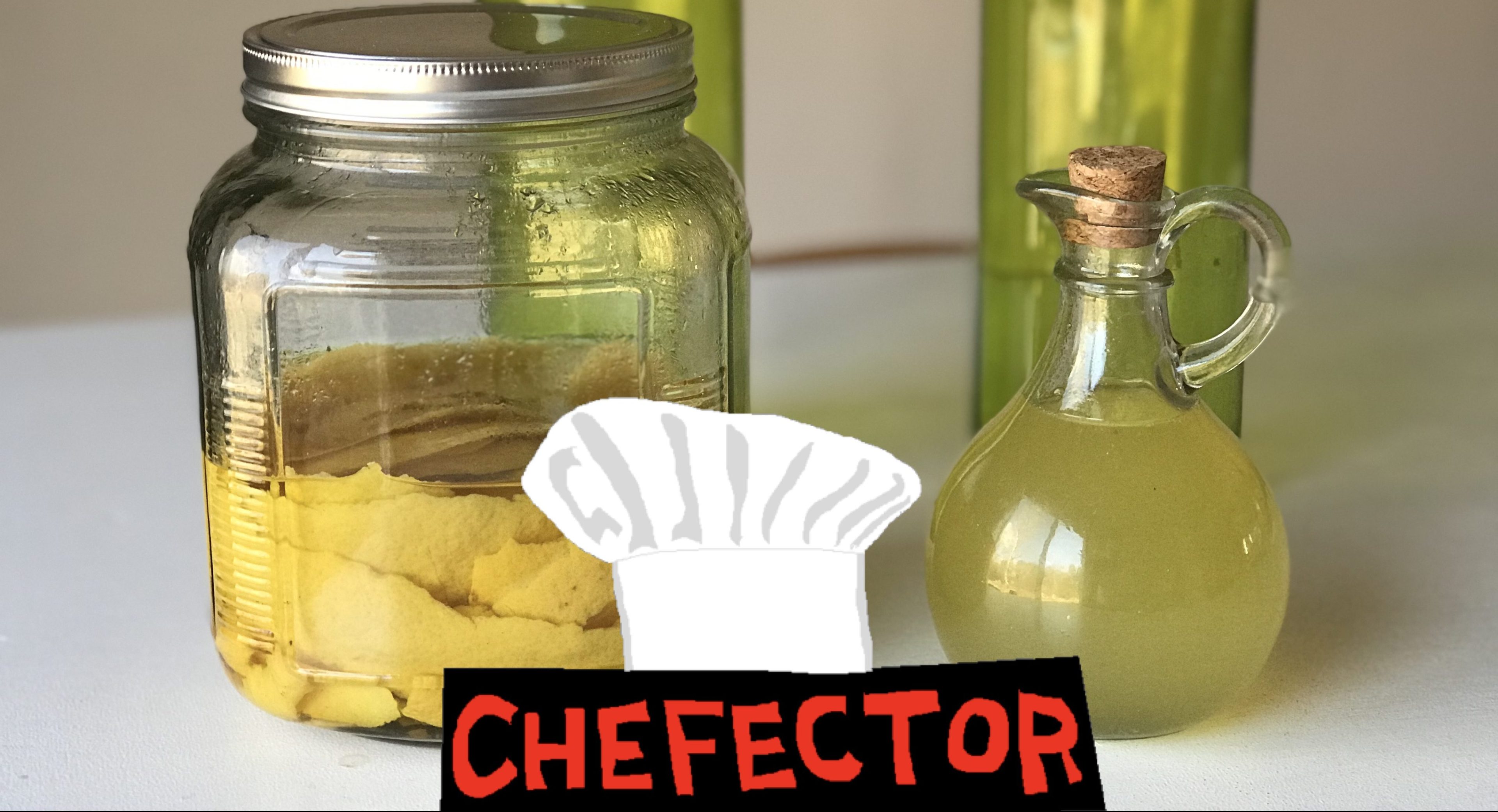 Lemon peels stewing in booze and a bottle of lemon syrup.
