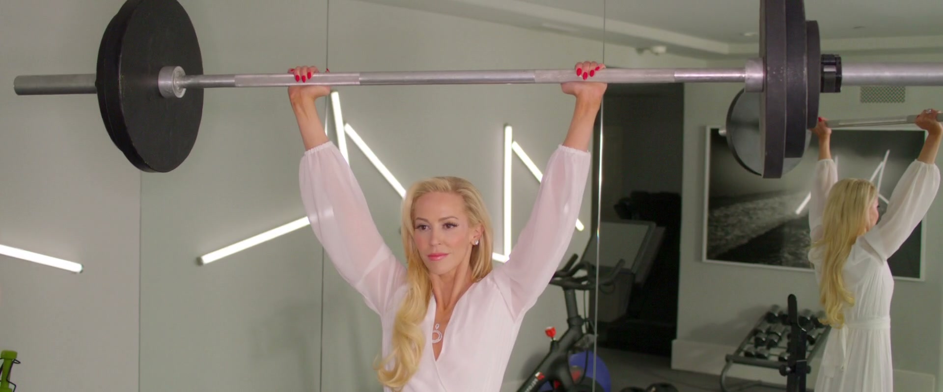 Louise Linton lifts a barbell