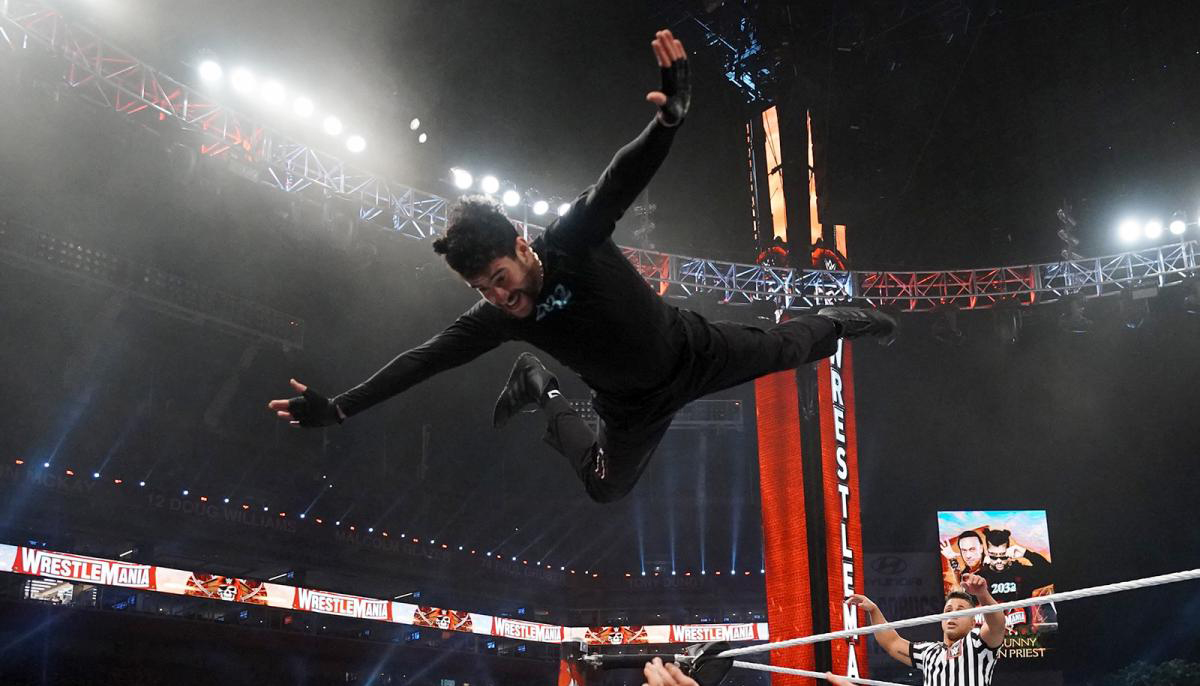 Bad Bunny flies to the outside at WrestleMania 37