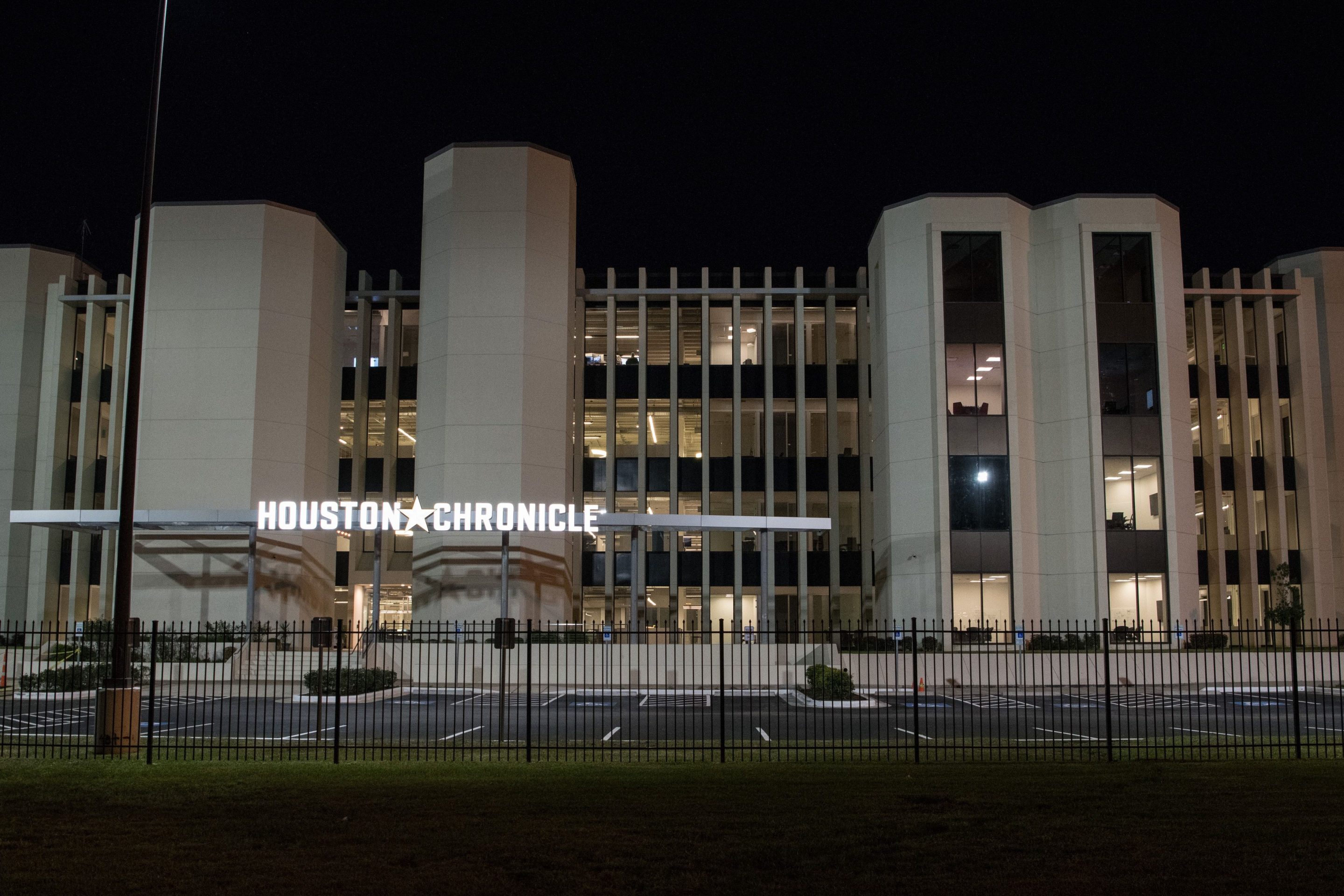 The front of the Houston Chronicle building at night
