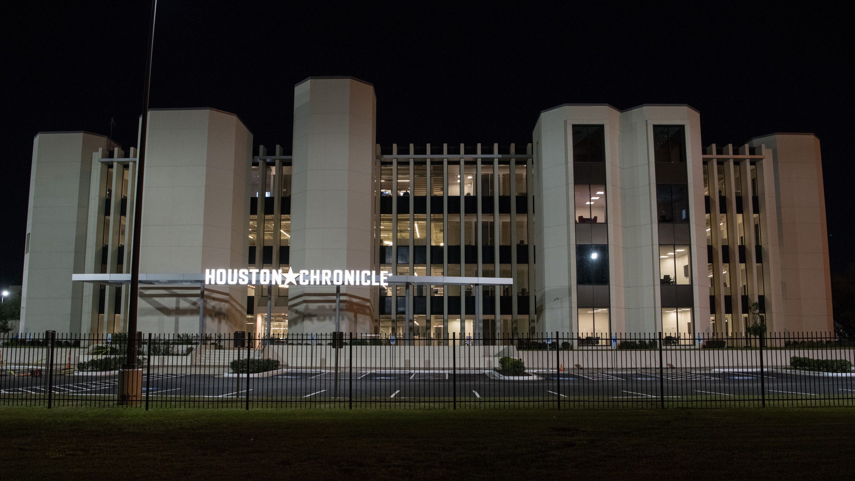 The front of the Houston Chronicle building at night
