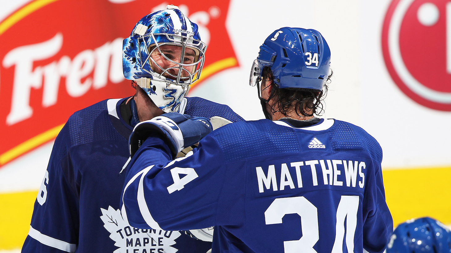 TORONTO, ON - APRIL 7: Jack Campbell #36 of the Toronto Maple Leafs is congratulated by teammate Auston Matthews #34 for breaking the consecutive win record for a Leaf against the Montreal Canadiens during an NHL game at Scotiabank Arena on April 7, 2021 in Toronto, Ontario, Canada. The Maple Leafs defeated the Canadiens 3-2. (Photo by Claus Andersen/Getty Images) *** Local Caption *** Jack Campbell; Auston Matthews
