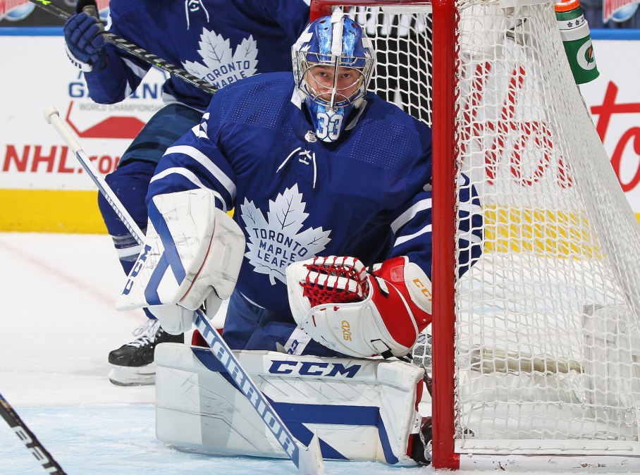 TORONTO, ON - APRIL 13: David Rittich #33 of the Toronto Maple Leafs protects the corner against the Calgary Flames during an NHL game at Scotiabank Arena on April 13, 2021 in Toronto, Ontario, Canada. (Photo by Claus Andersen/Getty Images) *** Local Caption *** David Rittich