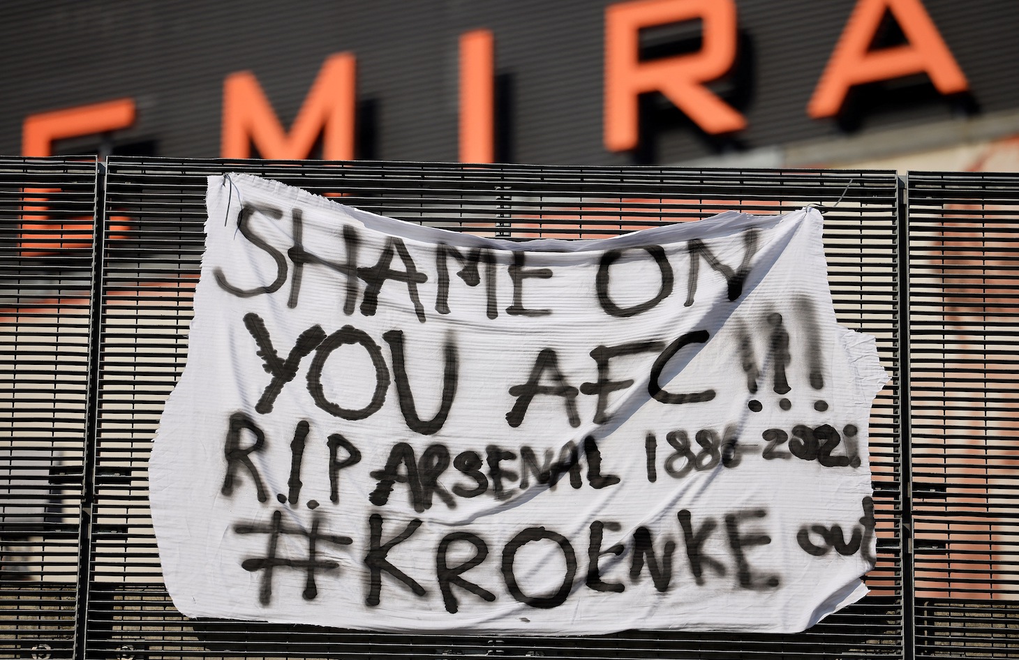 An anti-European Super League banner is pictured outside the Emirates Stadium, home of English Premier League football club Arsenal, in north London on April 19, 2021. - Twelve of Europe's biggest clubs on Monday said they planned to launch a breakaway Super League, despite the threat of an international ban for them and their players. "AC Milan, Arsenal, Atletico Madrid, Chelsea, Barcelona, Inter Milan, Juventus, Liverpool, Manchester City, Manchester United, Real Madrid and Tottenham Hotspur have all joined as founding clubs," said a statement by the group. (Photo by Tolga Akmen / AFP) (Photo by TOLGA AKMEN/AFP via Getty Images)