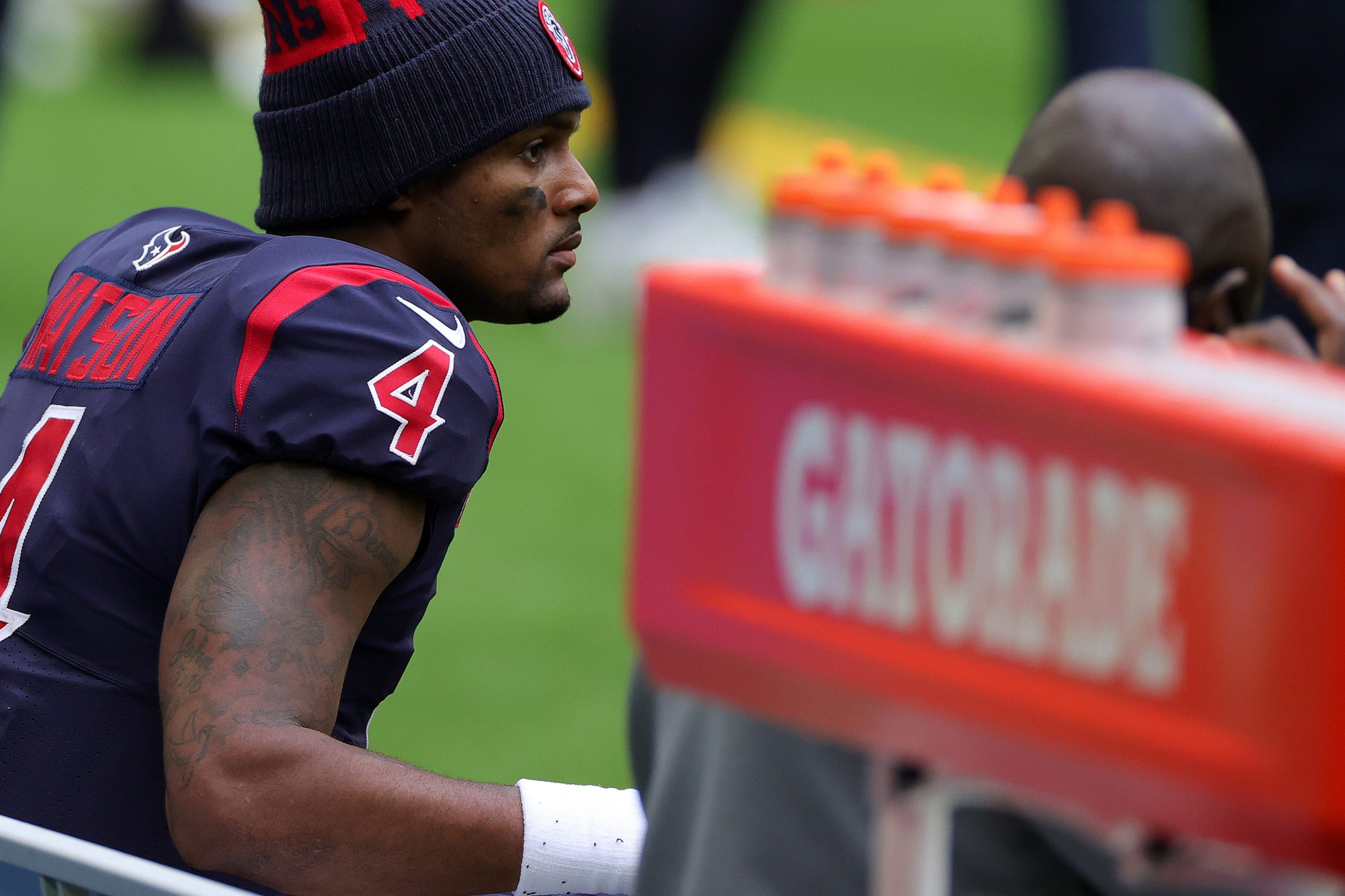Quarterback Deshaun Watson of the Houston Texans looks on from the bench late in the fourth quarter of the game against the Cincinnati Bengals at NRG Stadium on December 27, 2020 in Houston, Texas.