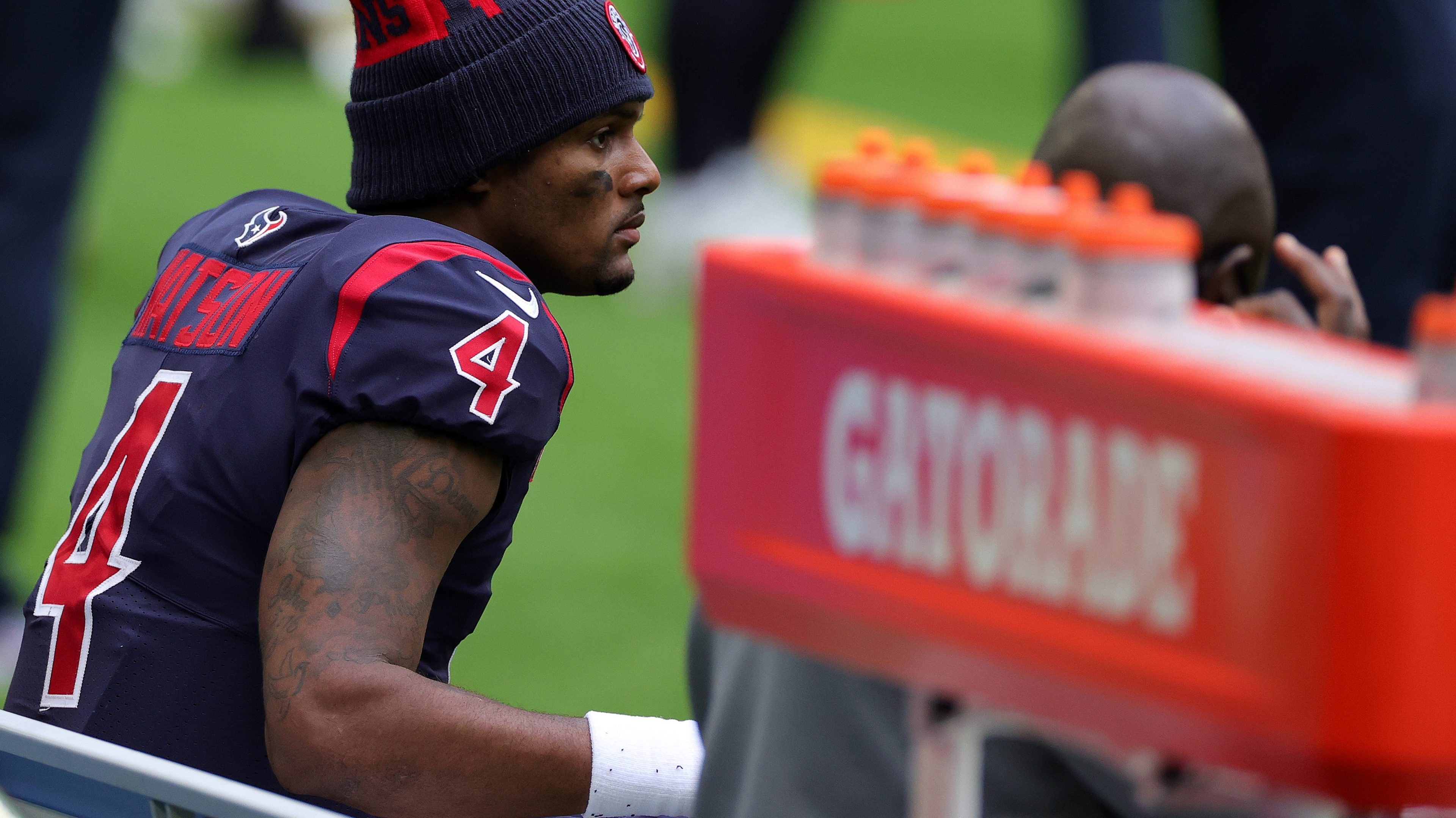 Quarterback Deshaun Watson of the Houston Texans looks on from the bench late in the fourth quarter of the game against the Cincinnati Bengals at NRG Stadium on December 27, 2020 in Houston, Texas.
