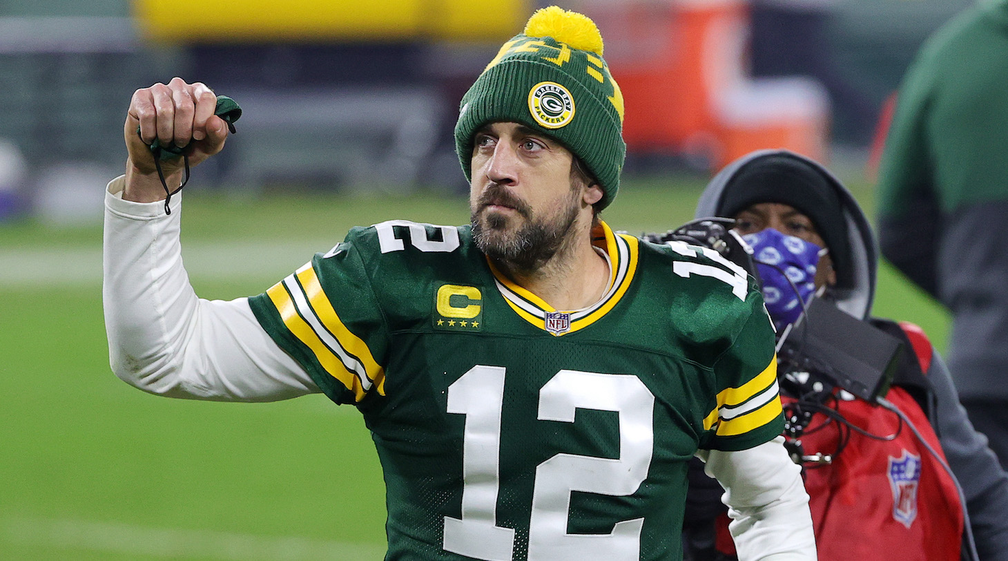 GREEN BAY, WISCONSIN - JANUARY 16: Aaron Rodgers #12 of the Green Bay Packers celebrates defeating the Los Angeles Rams 32-18 in the NFC Divisional Playoff game at Lambeau Field on January 16, 2021 in Green Bay, Wisconsin. (Photo by Stacy Revere/Getty Images)