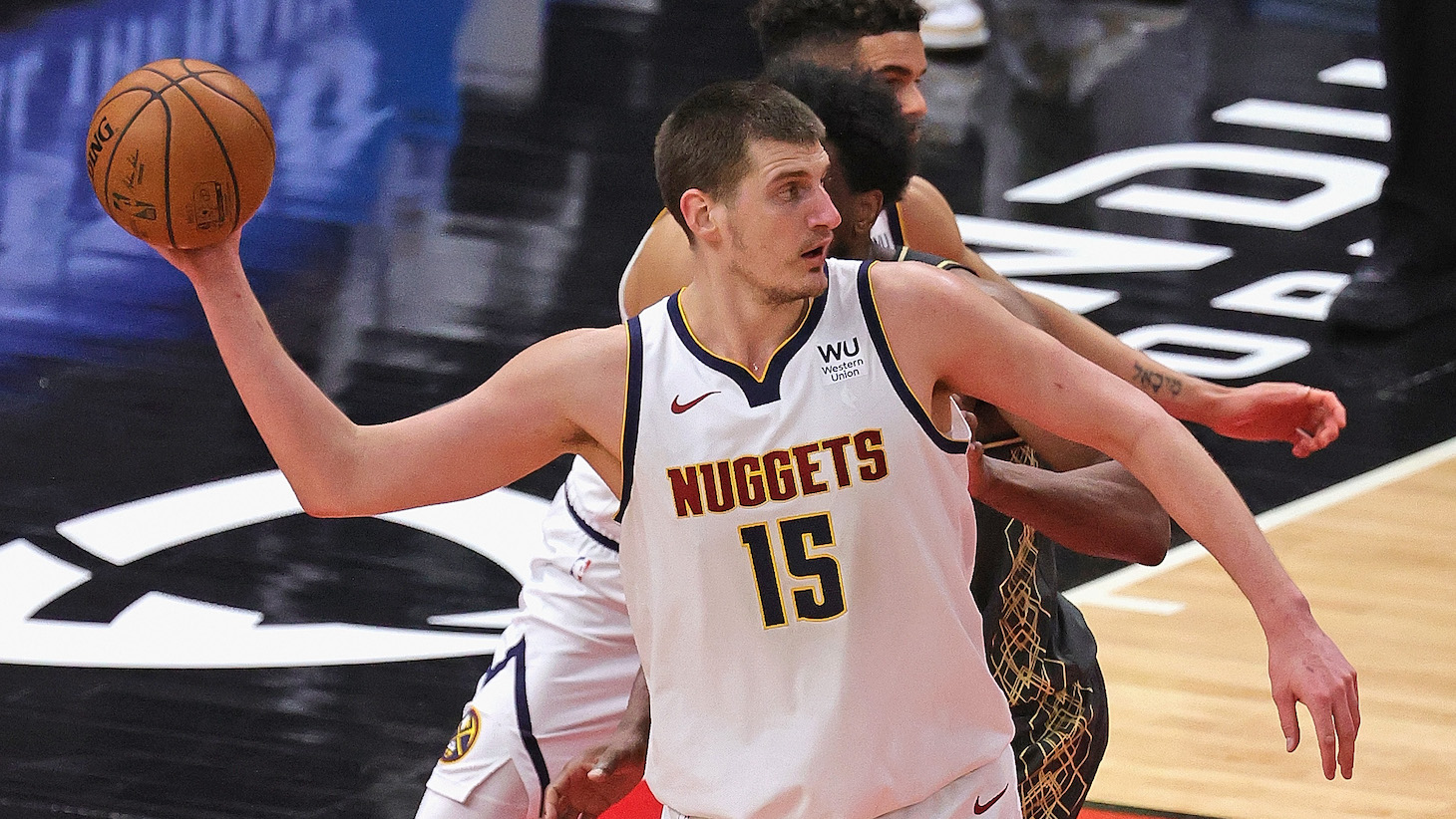 CHICAGO, ILLINOIS - MARCH 01: Nikola Jokic #15 of the Denver Nuggets passes downcourt against the Chicago Bulls at the United Center on March 01, 2021 in Chicago, Illinois. NOTE TO USER: User expressly acknowledges and agrees that, by downloading and or using this photograph, User is consenting to the terms and conditions of the Getty Images License Agreement. (Photo by Jonathan Daniel/Getty Images)