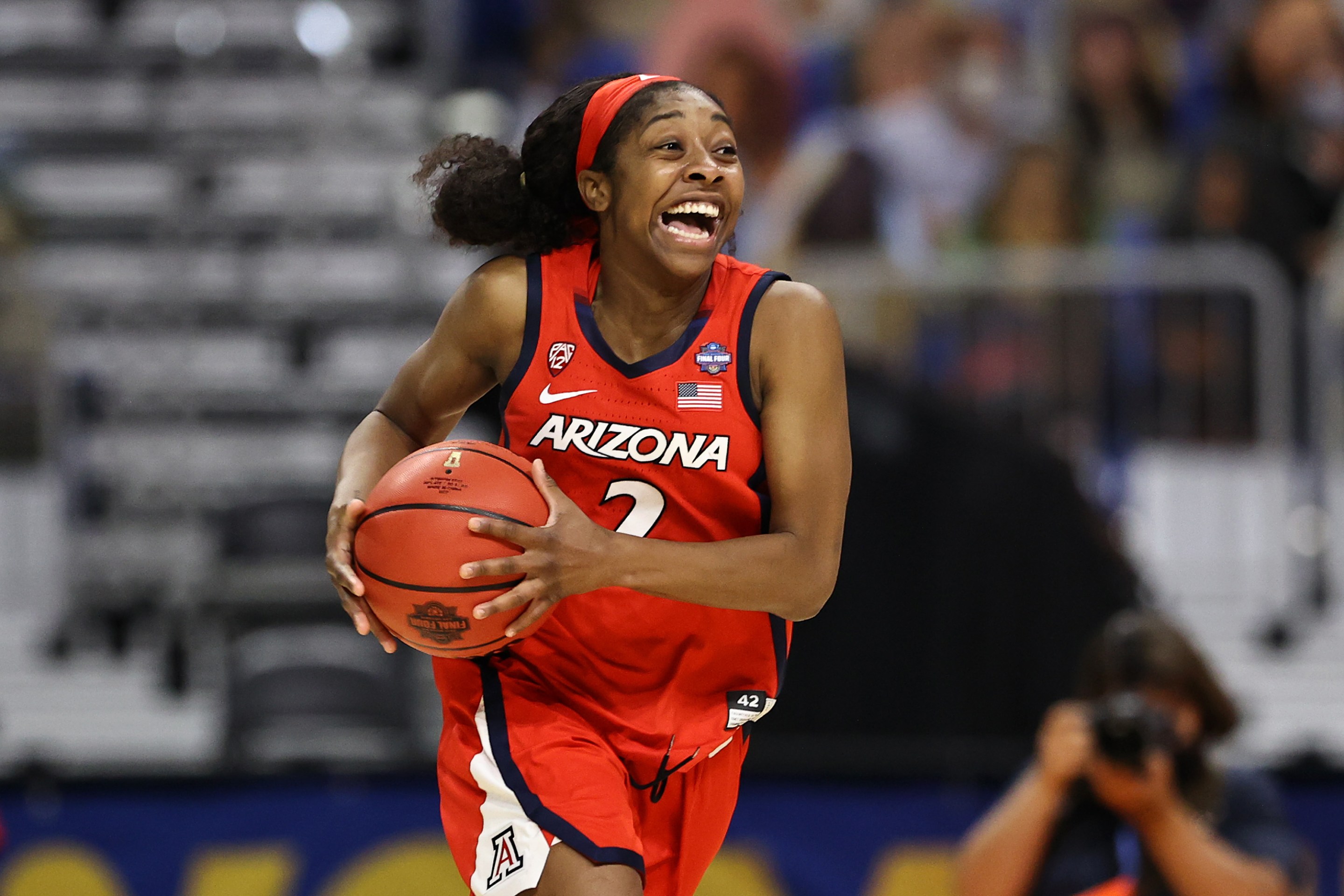 Aari McDonald #2 of the Arizona Wildcats celebrates after defeating the UConn Huskies during the third quarter in the Final Four semifinal game of the 2021 NCAA Women's Basketball Tournament at the Alamodome on April 02, 2021 in San Antonio, Texas. (