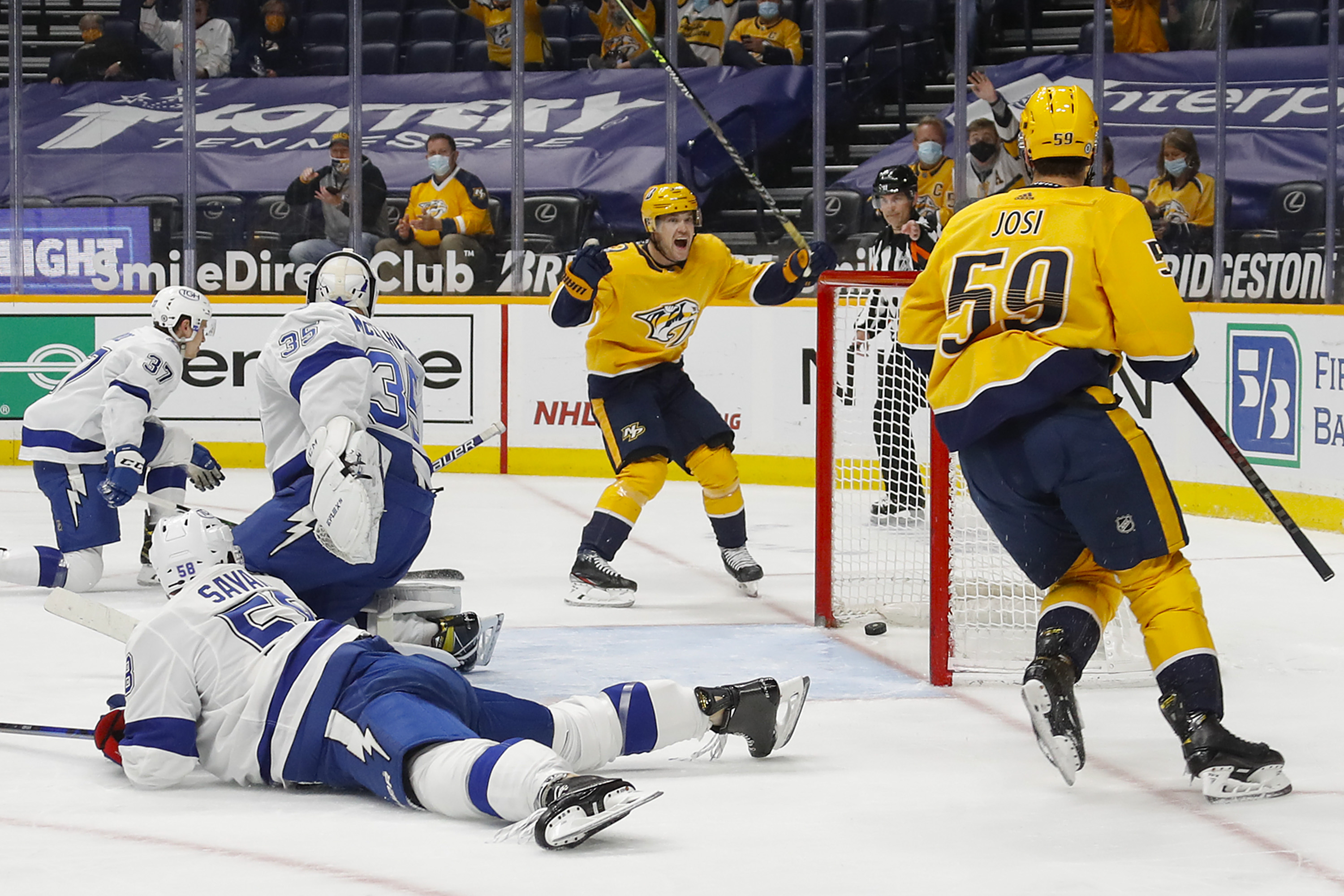 Viktor Arvidsson and Roman Josi celebrate after a goal