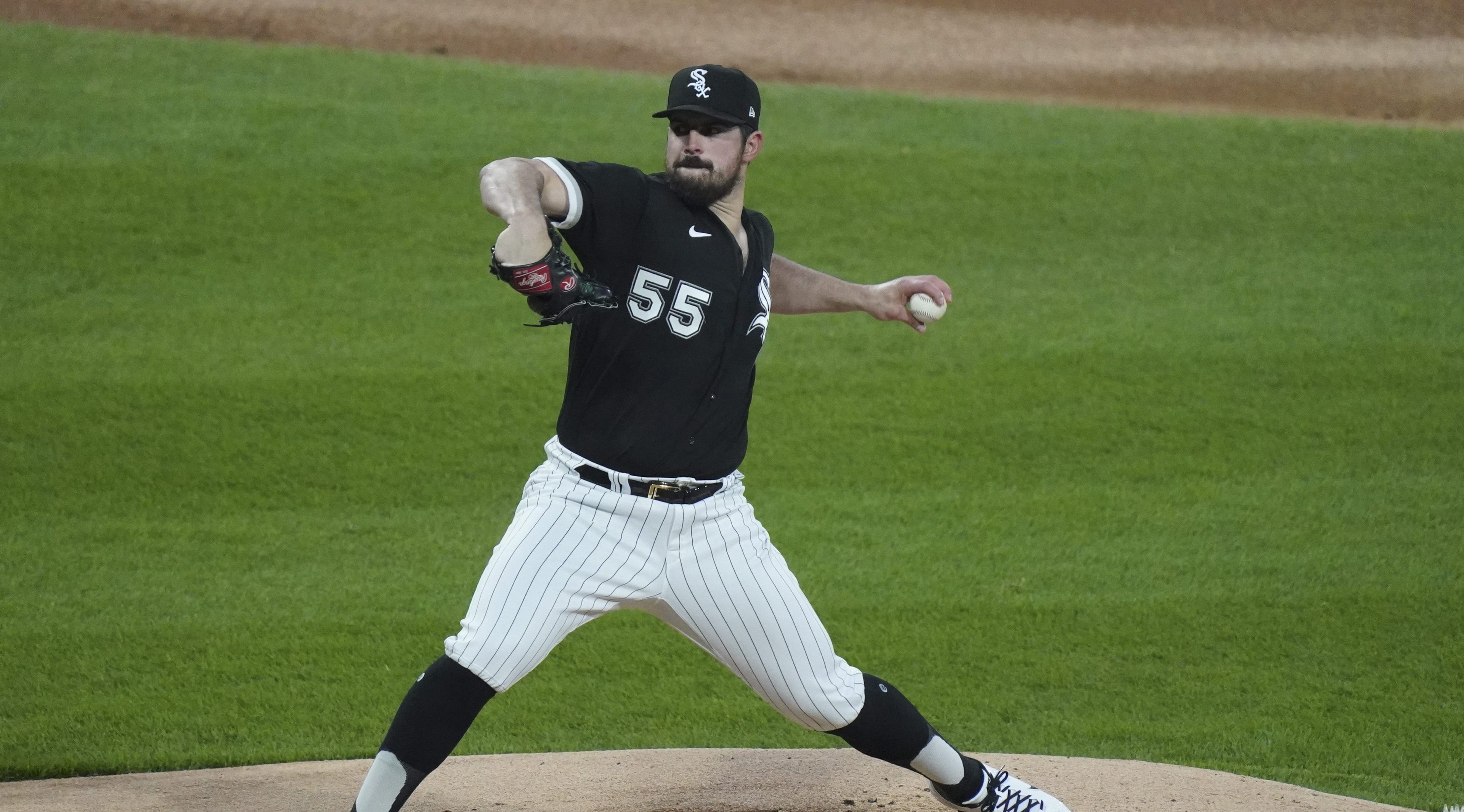 Carlos Rodon stretches through his pitching motion toward home.