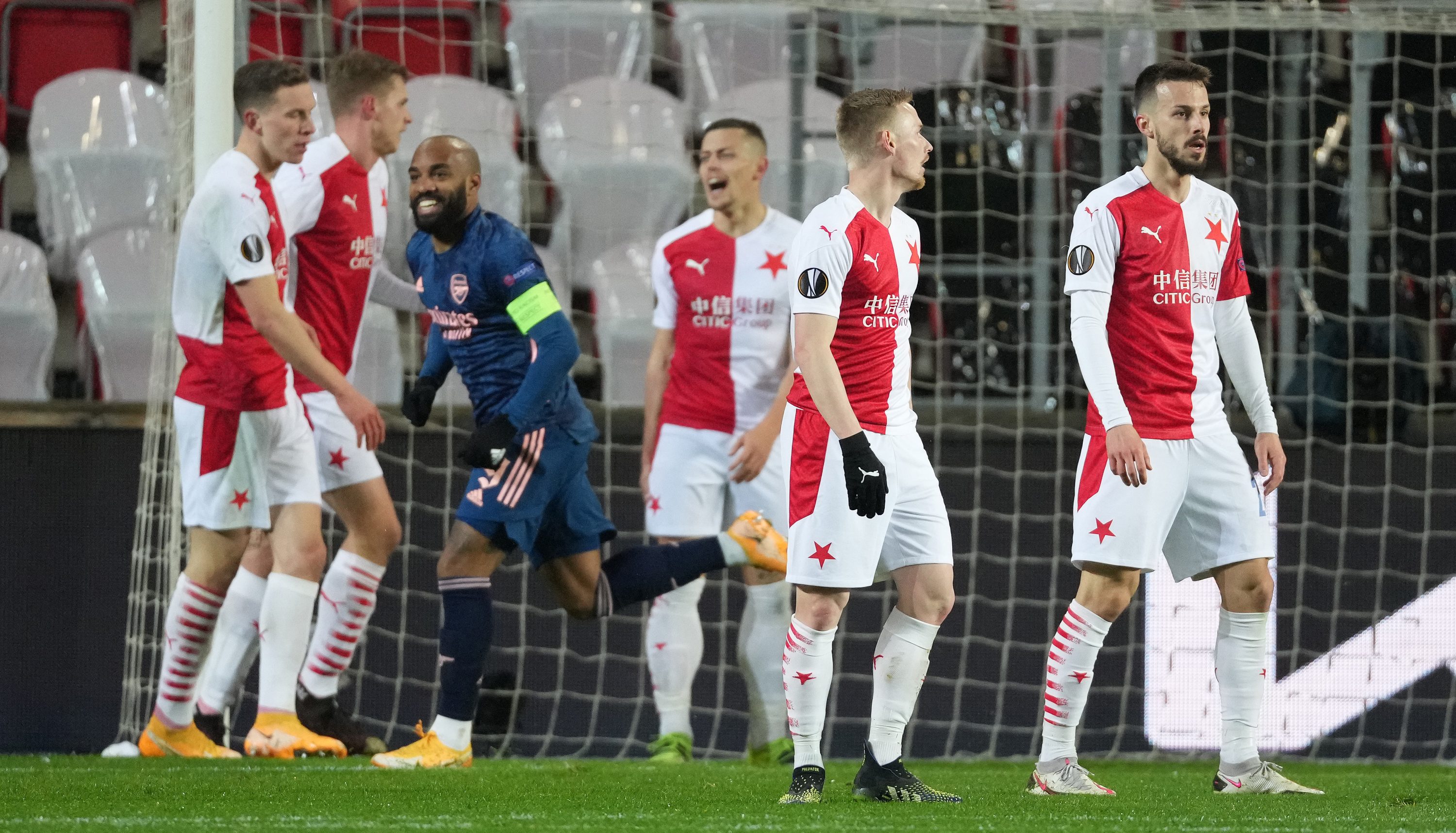 Players of Slavia Praha look dejected after Alexandre Lacazette of Arsenal scored his team's second goal from the penalty spot during the UEFA Europa League Quarter Final Second Leg match between Slavia Praha and Arsenal FC at Sinobo Stadium on April 15, 2021 in Prague, Czech Republic