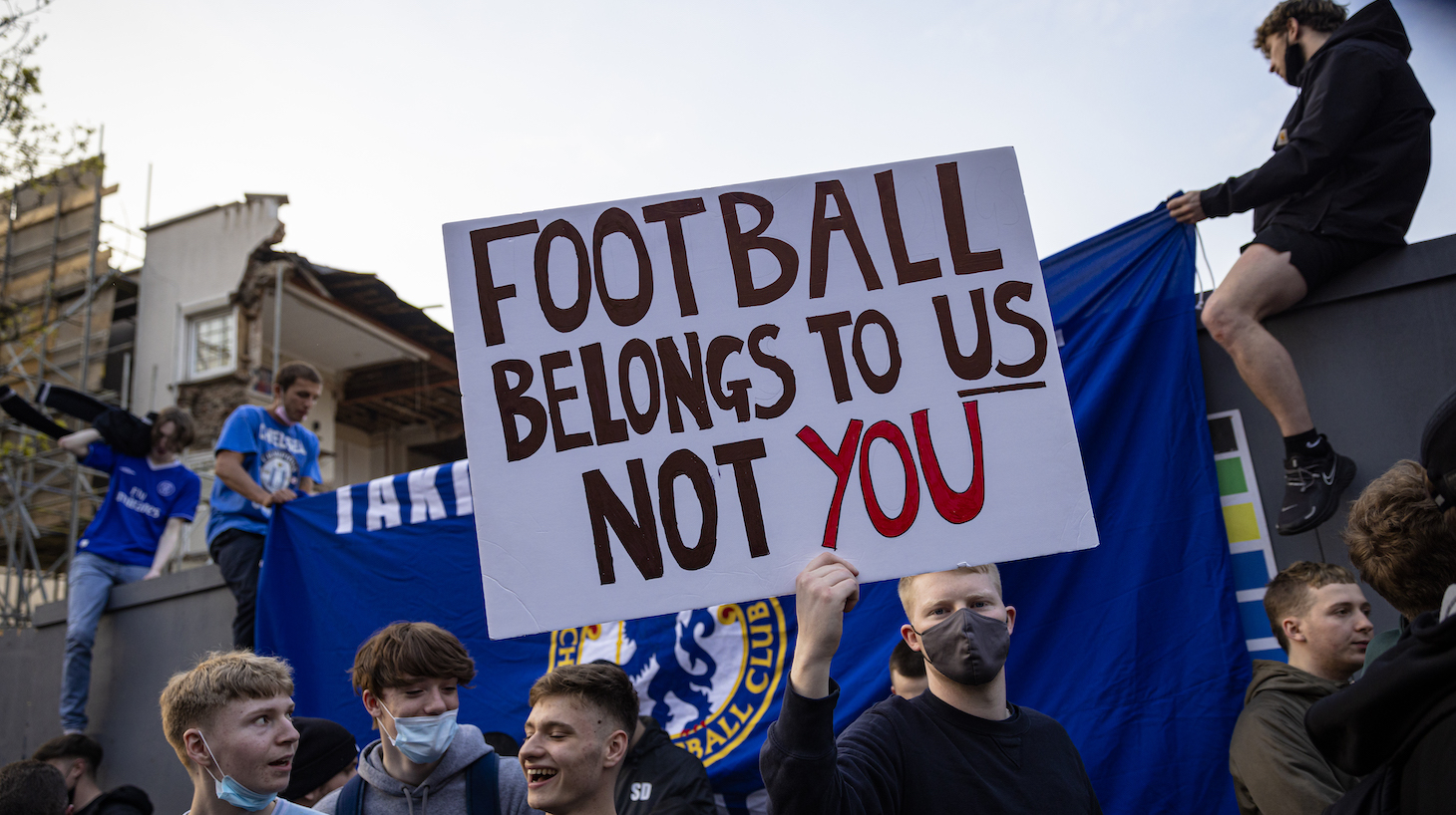 Chelsea Football Club fans celebrate outside the team's Stamford Bridge stadium on April 20, 2021 in London, England, after it was announced that Chelsea Football Club would seek to withdraw from the new European Super League. Six English premier league teams have announced they are part of plans for a breakaway European Super League. Arsenal, Manchester United, Manchester City, Liverpool, Chelsea and Tottenham Hotspur will join 12 other European teams in a closed league similar to that of the NFL American Football League. In a statement released last night, the new competition "is intended to commence as soon as practicable" potentially in August.