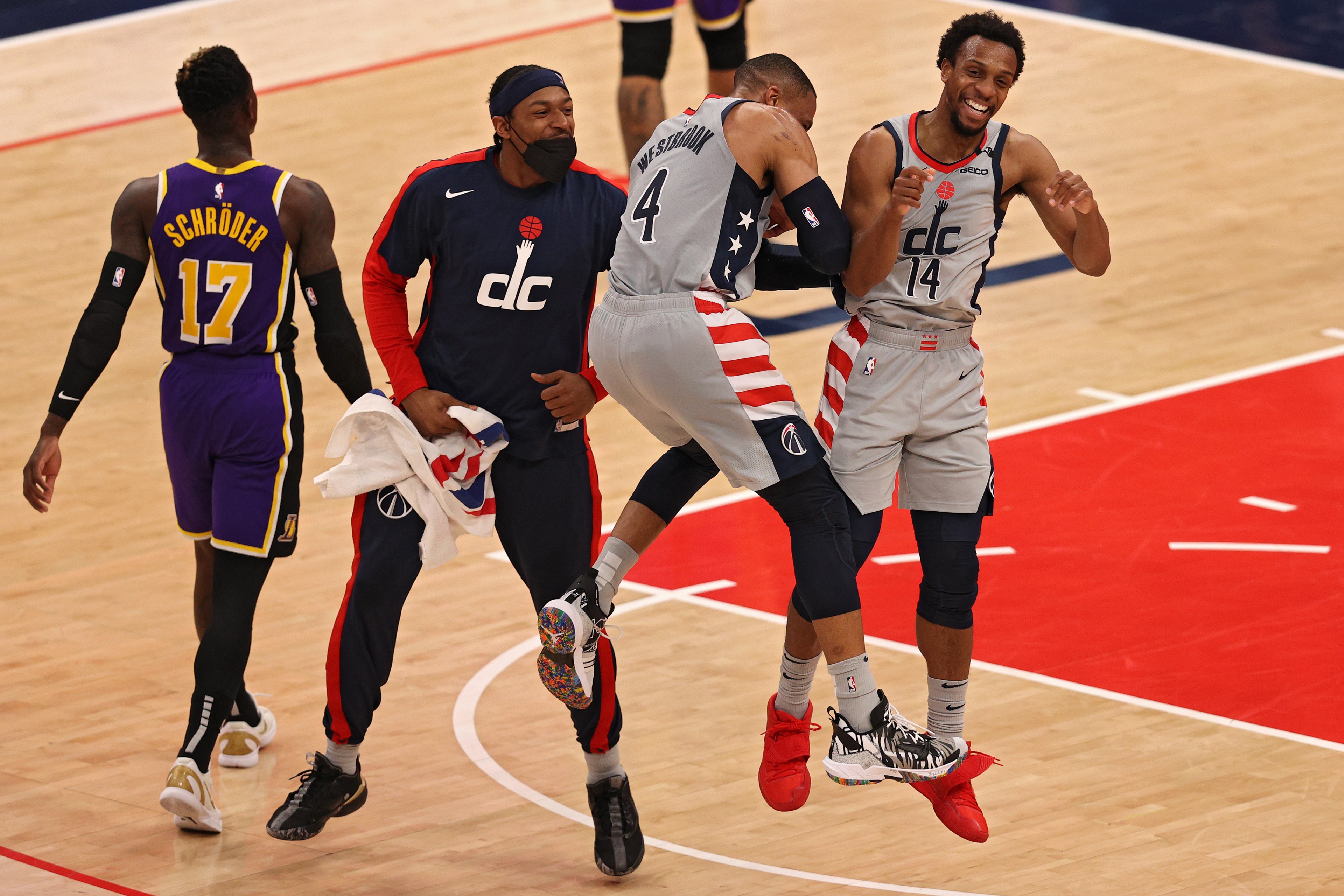 Russell Westbrook, Ish Smith, and Bradley Beal celebrate during the Wizards' win over the Lakers.