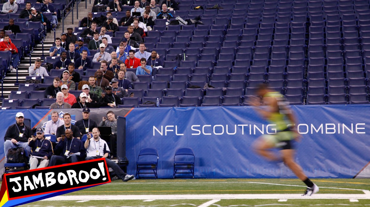 INDIANAPOLIS, IN - FEBRUARY 28: Scouts look on as a player runs the 40-yard dash during the 2012 NFL Combine at Lucas Oil Stadium on February 28, 2012 in Indianapolis, Indiana. (Photo by Joe Robbins/Getty Images)