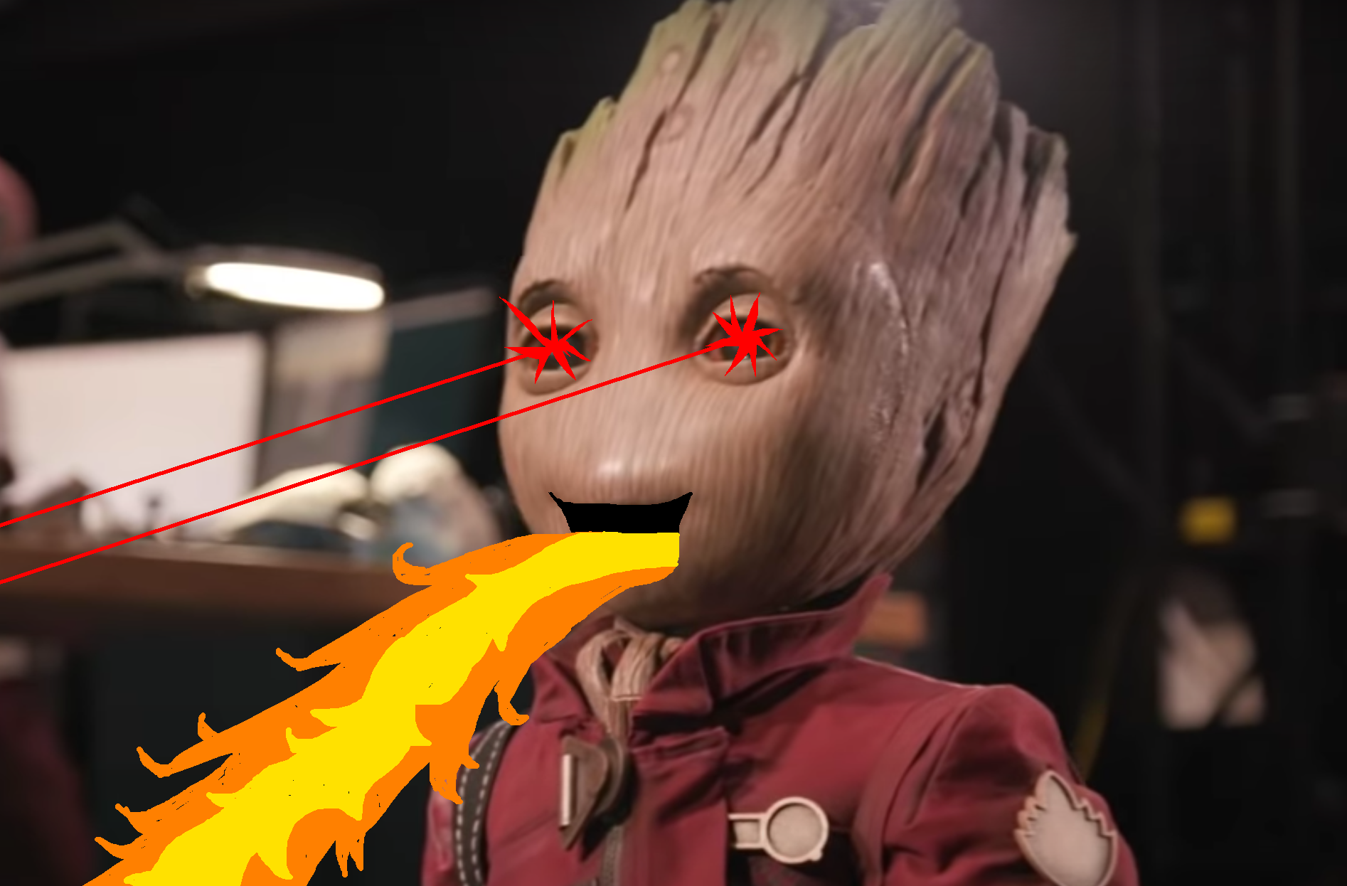 The Groot animatronic depicted with lasers for eyes and belching fire.