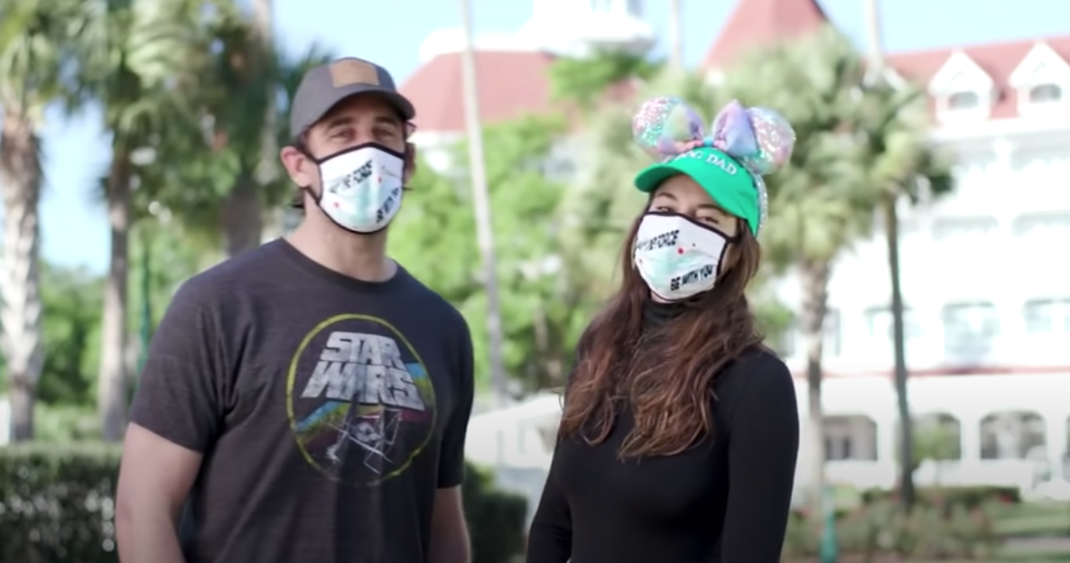 A screenshot of Aaron Rodgers and Shailene Woodley at Disney World. They are both wearing masks.