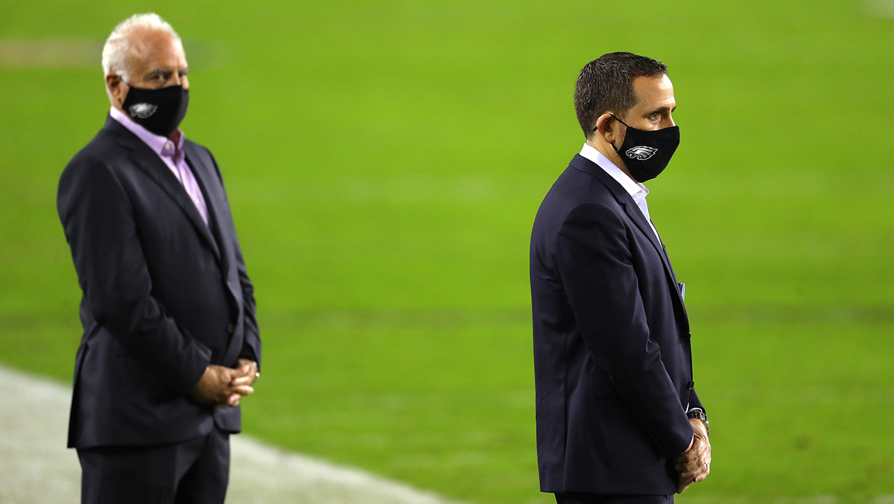 Jeffrey Lurie (Eagles owner) and Howie Roseman (Eagles GM, basically) stand in suits on the sideline. It's 2020 so they're wearing masks.