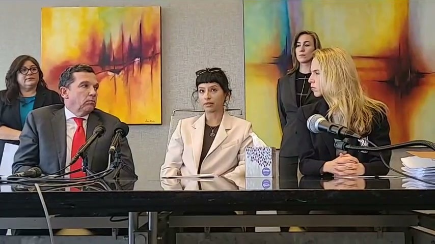 A photo of license massage therapist Ashley Solis as she speaks at a press conference. Solis described the quarterback of the Houston Texans, Deshaun Watson, forcing her to touch his penis during a massage he had hired her to provide. On her left and her right are the attorneys representing her.