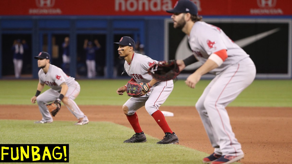 TORONTO, ON - MAY 22: Mookie Betts #50 of the Boston Red Sox comes in from right field and plays on the lip of the infield as the Red Sox emply a five-man infield with the bases loaded in the tenth inning during MLB game action against the Toronto Blue Jays at Rogers Centre on May 22, 2019 in Toronto, Canada. (Photo by Tom Szczerbowski/Getty Images) *** Local Caption *** Mookie Betts