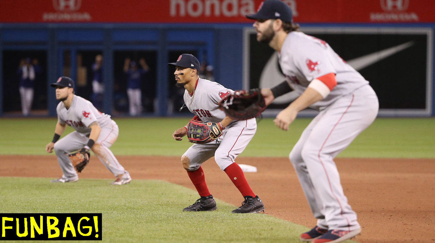 TORONTO, ON - MAY 22: Mookie Betts #50 of the Boston Red Sox comes in from right field and plays on the lip of the infield as the Red Sox emply a five-man infield with the bases loaded in the tenth inning during MLB game action against the Toronto Blue Jays at Rogers Centre on May 22, 2019 in Toronto, Canada. (Photo by Tom Szczerbowski/Getty Images) *** Local Caption *** Mookie Betts
