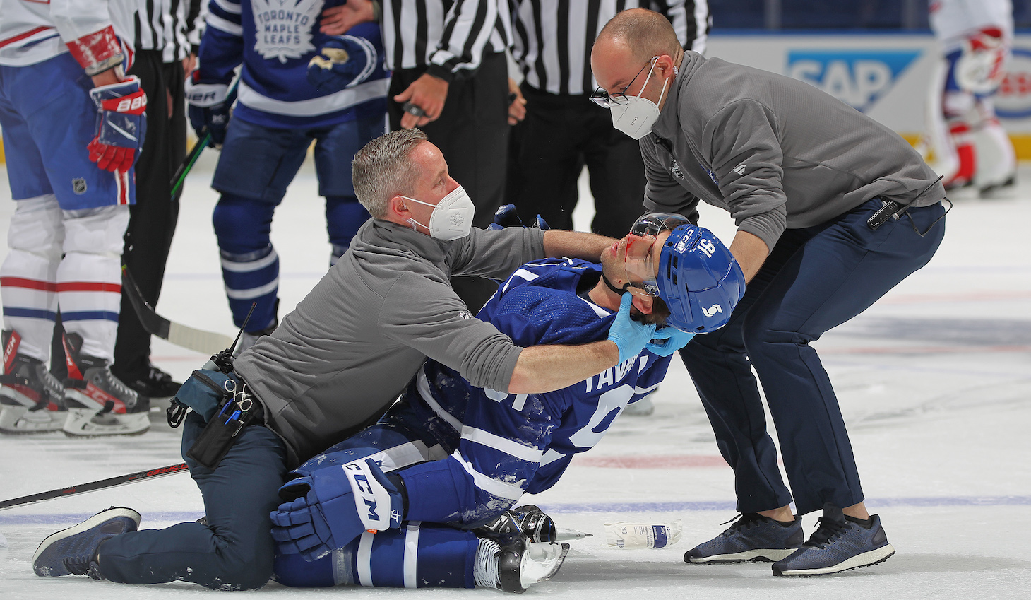 TORONTO, ON - MAY 20: John Tavares #91 of the Toronto Maple Leafs appears to suffer a significant injury against the Montreal Canadiens in Game One of the First Round of the 2021 Stanley Cup Playoffs at Scotiabank Arena on May 20, 2021 in Toronto, Ontario, Canada. (Photo by Claus Andersen/Getty Images) *** Local Caption *** John Tavares