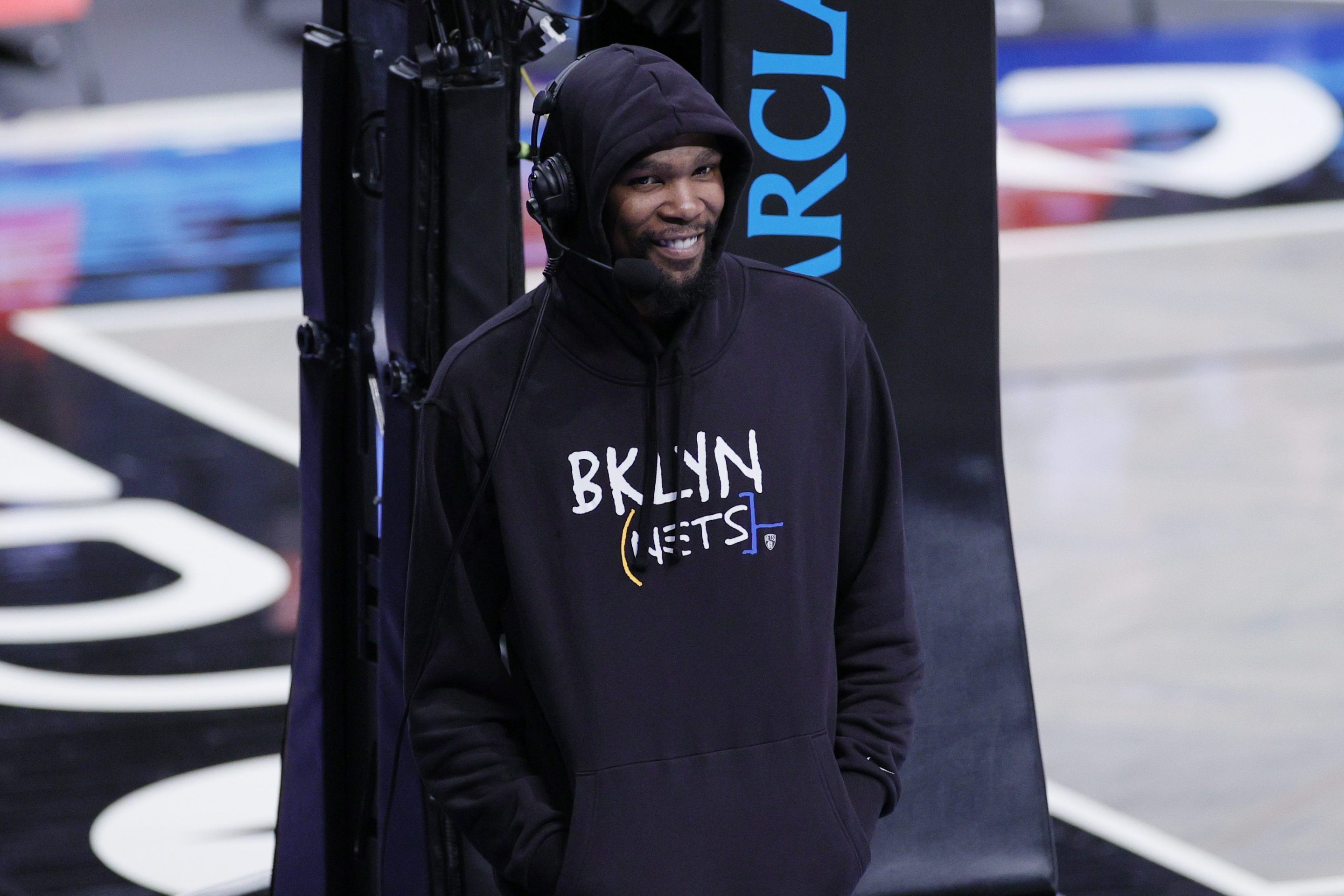 Kevin Durant of the Brooklyn Nets, in a hoodie, making a goofus face