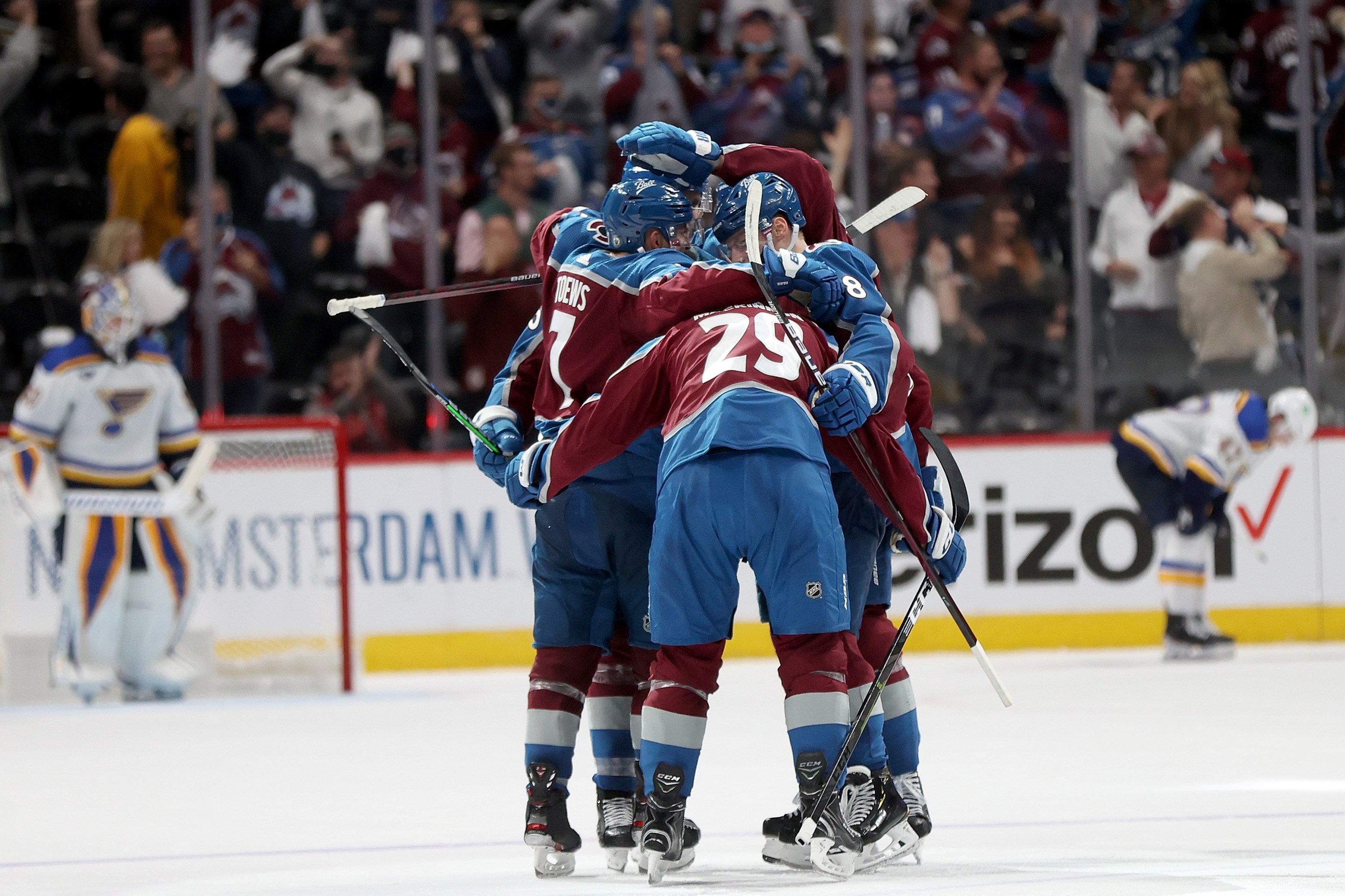 The Colorado Avalanche celebrate a goal by Nathan MacKinnon