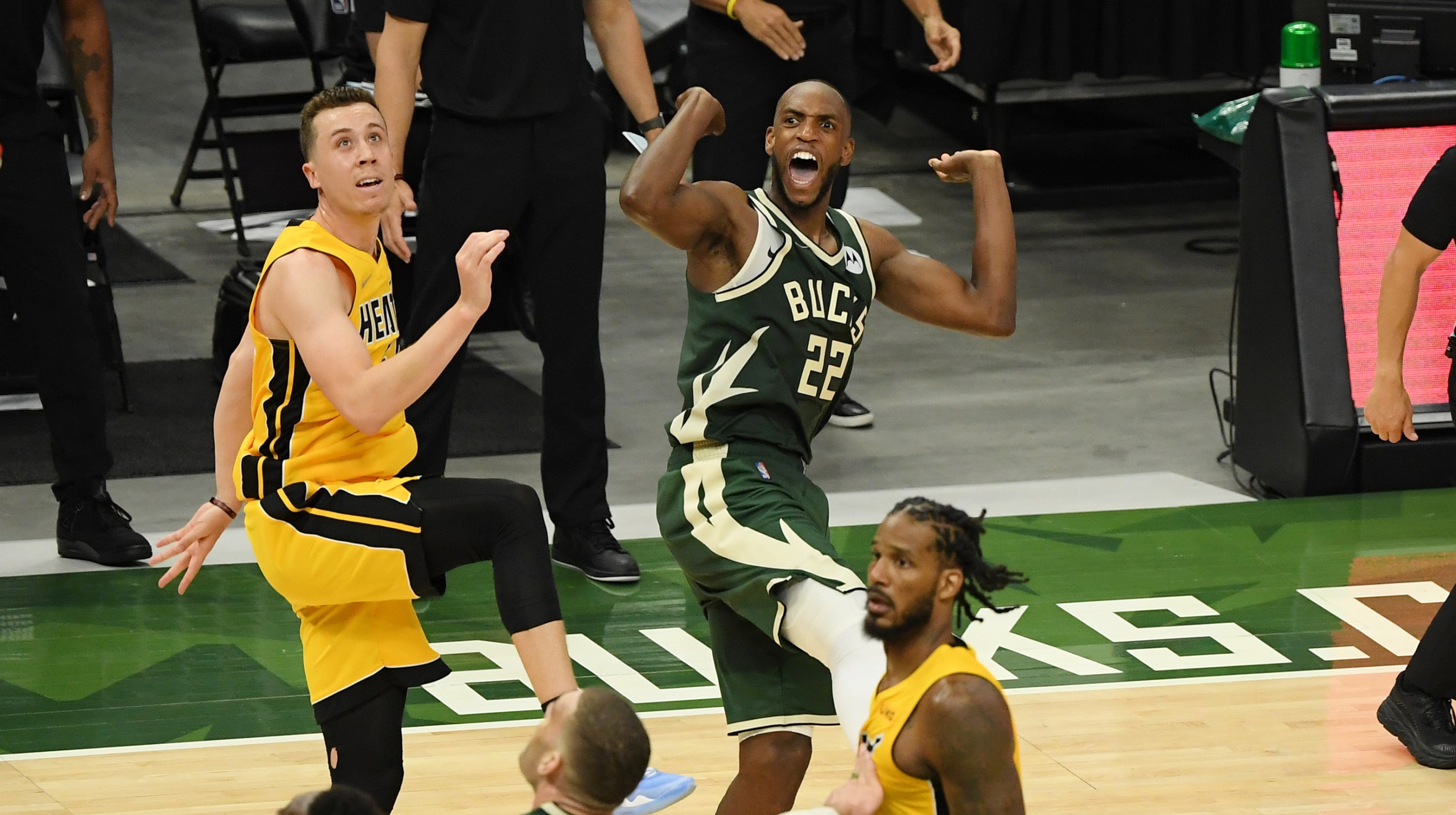 Khris Middleton #22 of the Milwaukee Bucks reacts after scoring in overtime against Duncan Robinson #55 of the Miami Heat during Game 1 of their Eastern Conference first-round playoff series between the Milwaukee Bucks and the Miami Heat at Fiserv Forum on May 22, 2021 in Milwaukee, Wisconsin.