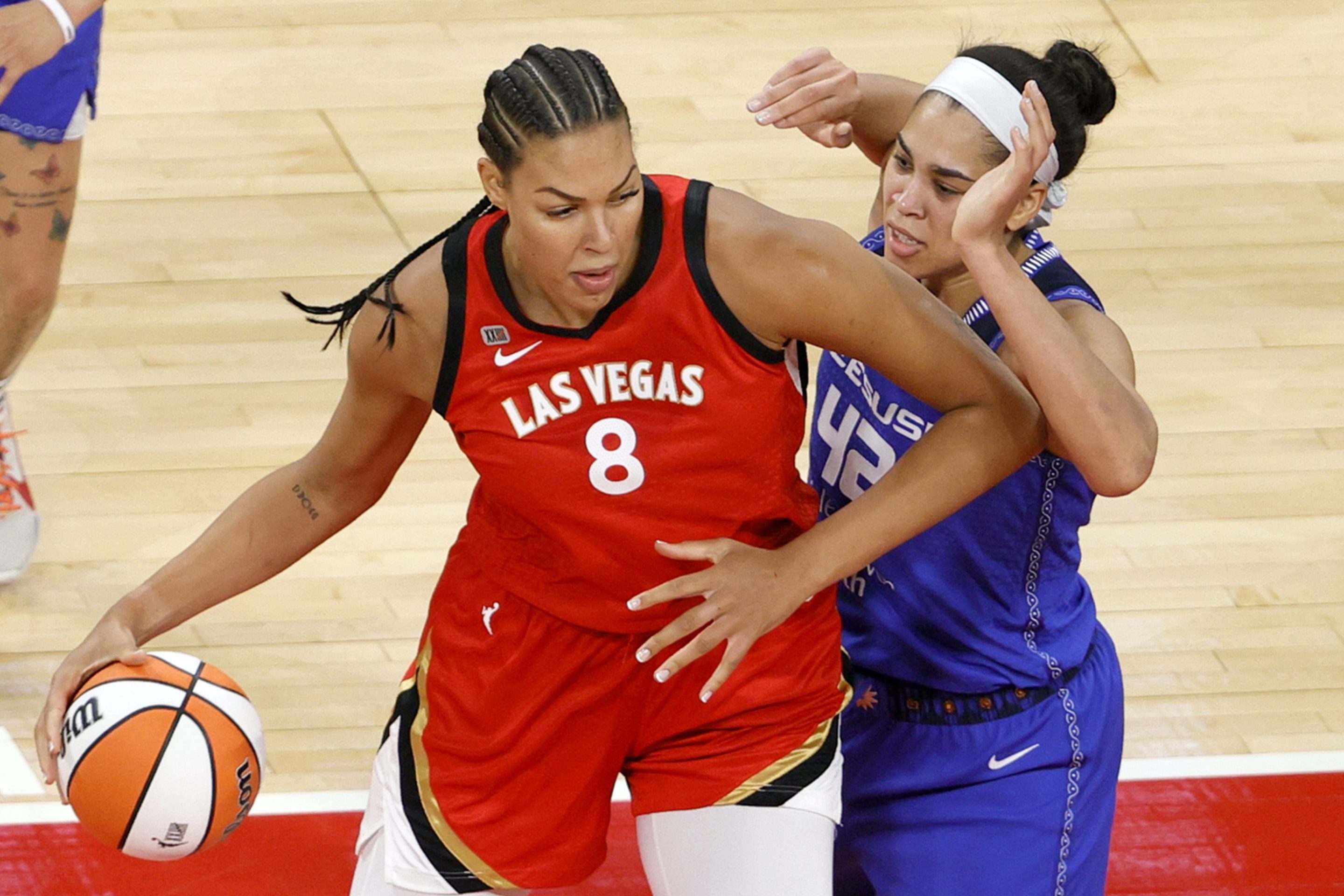 Liz Cambage #8 of the Las Vegas Aces is guarded by Brionna Jones #42 of the Connecticut Sun during their game at Michelob ULTRA Arena on May 23, 2021 in Las Vegas, Nevada. The Sun defeated the Aces 72-65.