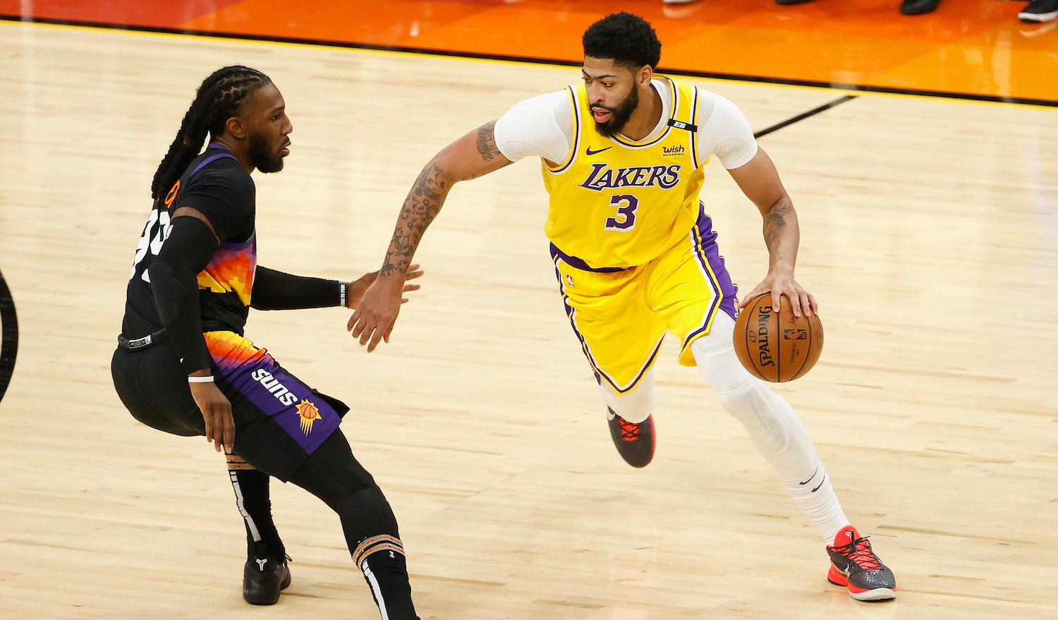 PHOENIX, ARIZONA - MAY 25: Anthony Davis #3 of the Los Angeles Lakers drives the ball against Jae Crowder #99 of the Phoenix Suns during the second half of Game Two of the Western Conference first-round playoff series at Phoenix Suns Arena on May 25, 2021 in Phoenix, Arizona. NOTE TO USER: User expressly acknowledges and agrees that, by downloading and or using this photograph, User is consenting to the terms and conditions of the Getty Images License Agreement. (Photo by Christian Petersen/Getty Images)