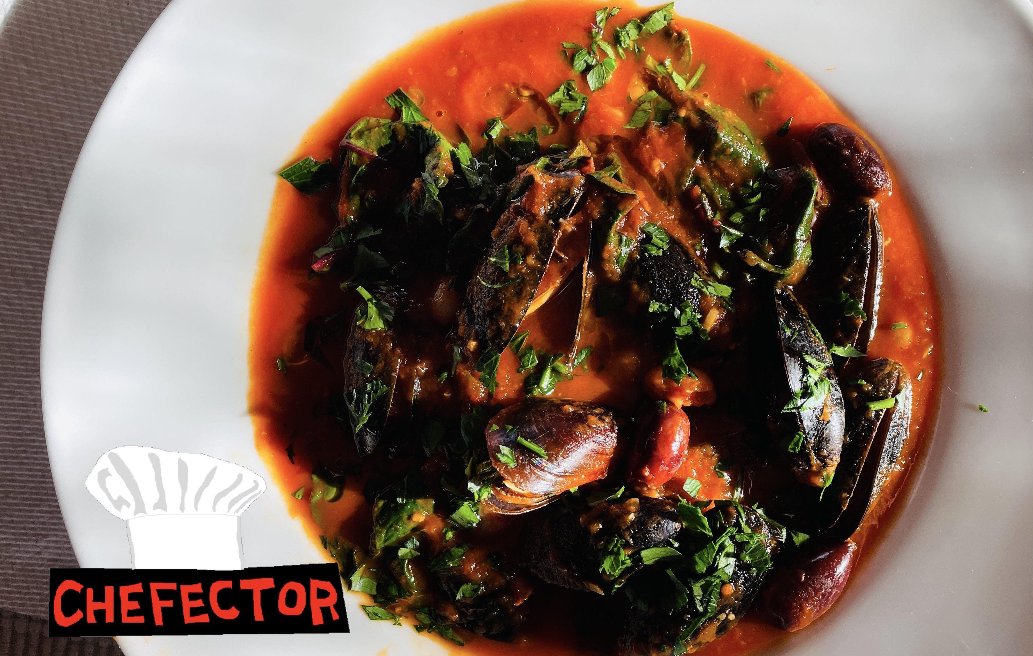A bowl of mussels and broth