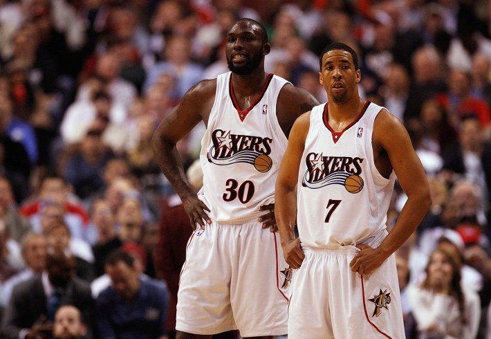 Reggie Evans and Andre Miller look sad