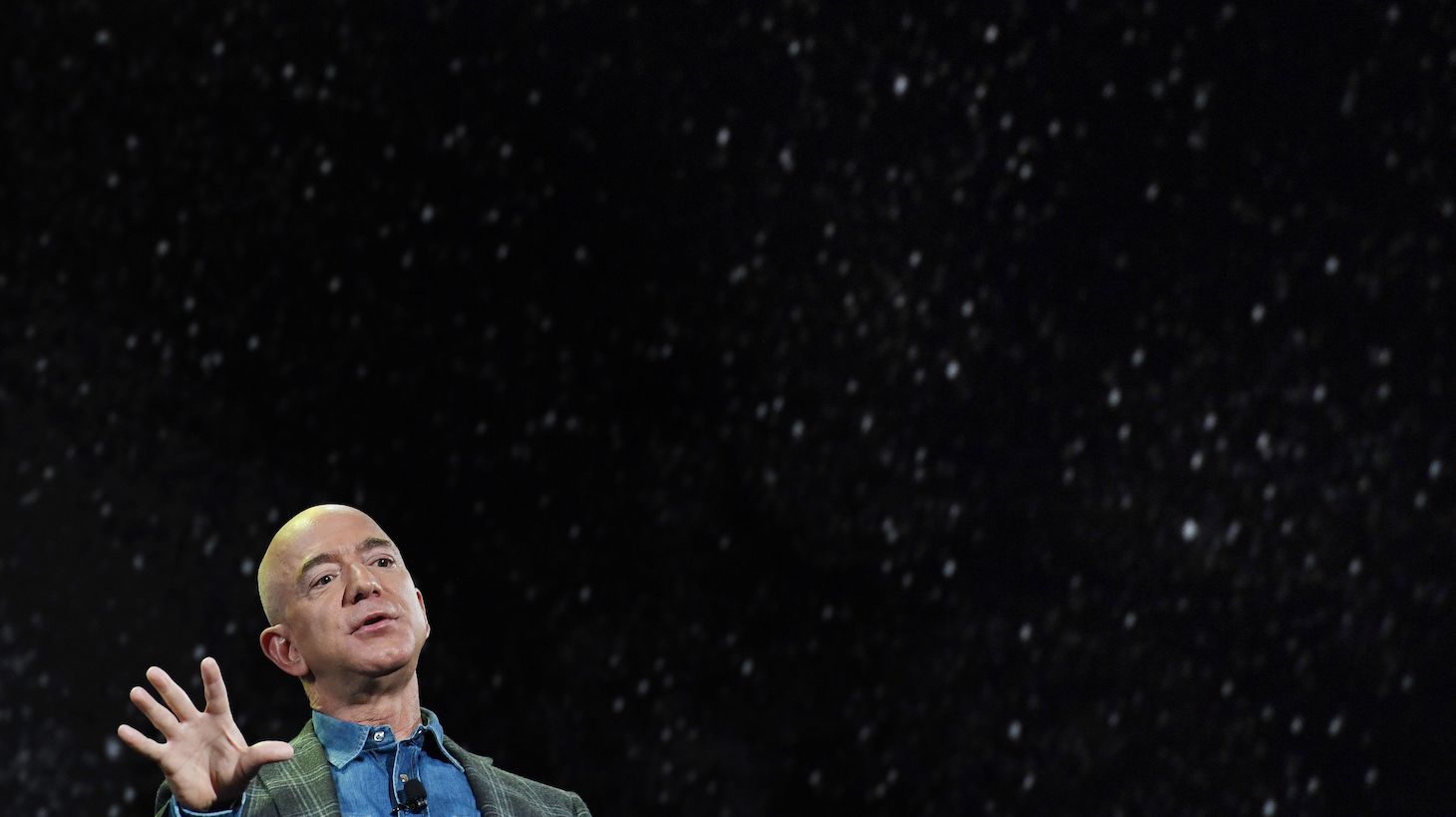Amazon Founder and CEO Jeff Bezos talks about his 'Blue Origin Space Program' during a keynote session at the Amazon Re:MARS conference on robotics and artificial intelligence at the Aria Hotel in Las Vegas, Nevada on June 6, 2019. (Photo by Mark RALSTON / AFP) (Photo by MARK RALSTON/AFP via Getty Images)