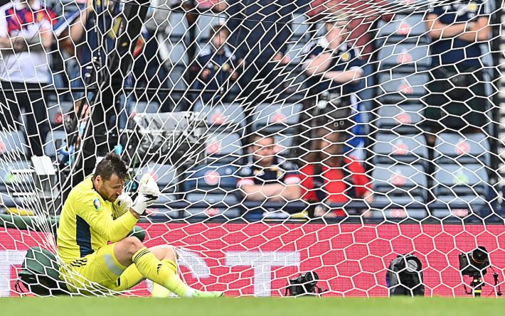 Scotland's goalkeeper David Marshall falls in the net after missing a save on Czech Republic's second goal during the UEFA EURO 2020 Group D football match between Scotland and Czech Republic at Hampden Park in Glasgow on June 14, 2021. (Photo by Paul ELLIS / POOL / AFP) (Photo by PAUL ELLIS/POOL/AFP via Getty Images)