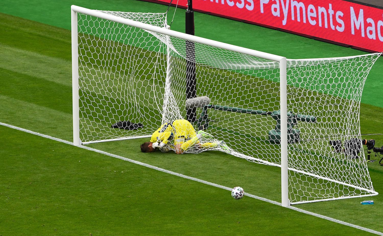 Scotland's goalkeeper David Marshall falls in the net after missing a save on Czech Republic's second goal during the UEFA EURO 2020 Group D football match between Scotland and Czech Republic at Hampden Park in Glasgow on June 14, 2021. (Photo by ANDY BUCHANAN / POOL / AFP) (Photo by ANDY BUCHANAN/POOL/AFP via Getty Images)