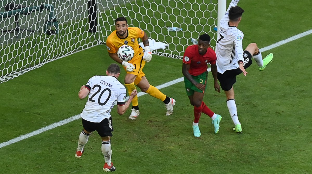 Germany's defender Robin Gosens (L) heads the ball to score their fourth goal during the UEFA EURO 2020 Group F football match between Portugal and Germany at Allianz Arena in Munich on June 19, 2021.