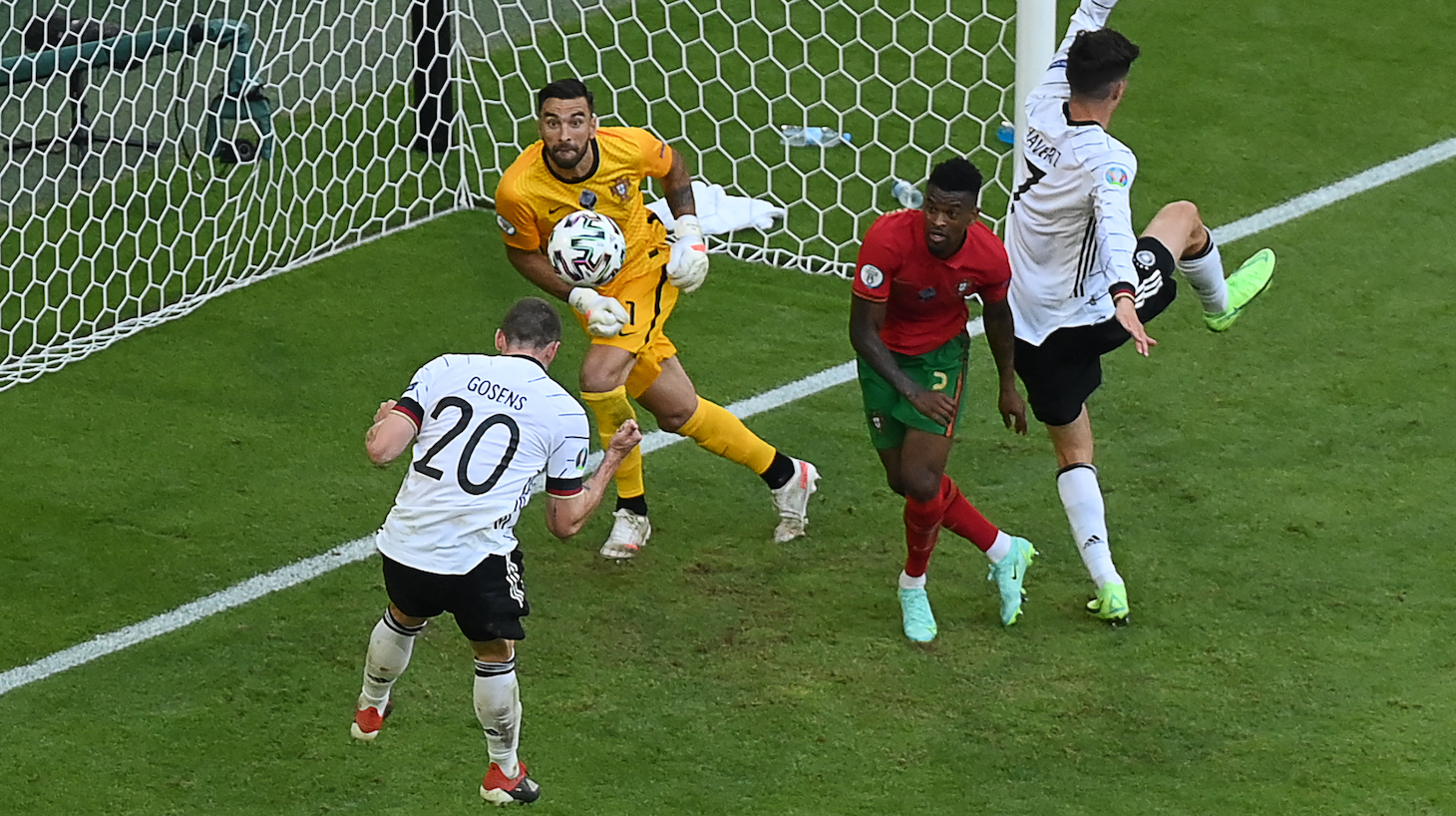 Germany's defender Robin Gosens (L) heads the ball to score their fourth goal during the UEFA EURO 2020 Group F football match between Portugal and Germany at Allianz Arena in Munich on June 19, 2021.