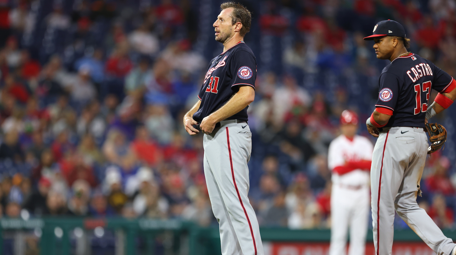 PHILADELPHIA, PA - JUNE 22: Pitcher Max Scherzer #31 of the Washington Nationals takes off his belt after throwing his cap and glove down as umpires ask to search him for sticky substances during the fourth inning of a game against the Philadelphia Phillies at Citizens Bank Park on June 22, 2021 in Philadelphia, Pennsylvania. (Photo by Rich Schultz/Getty Images)