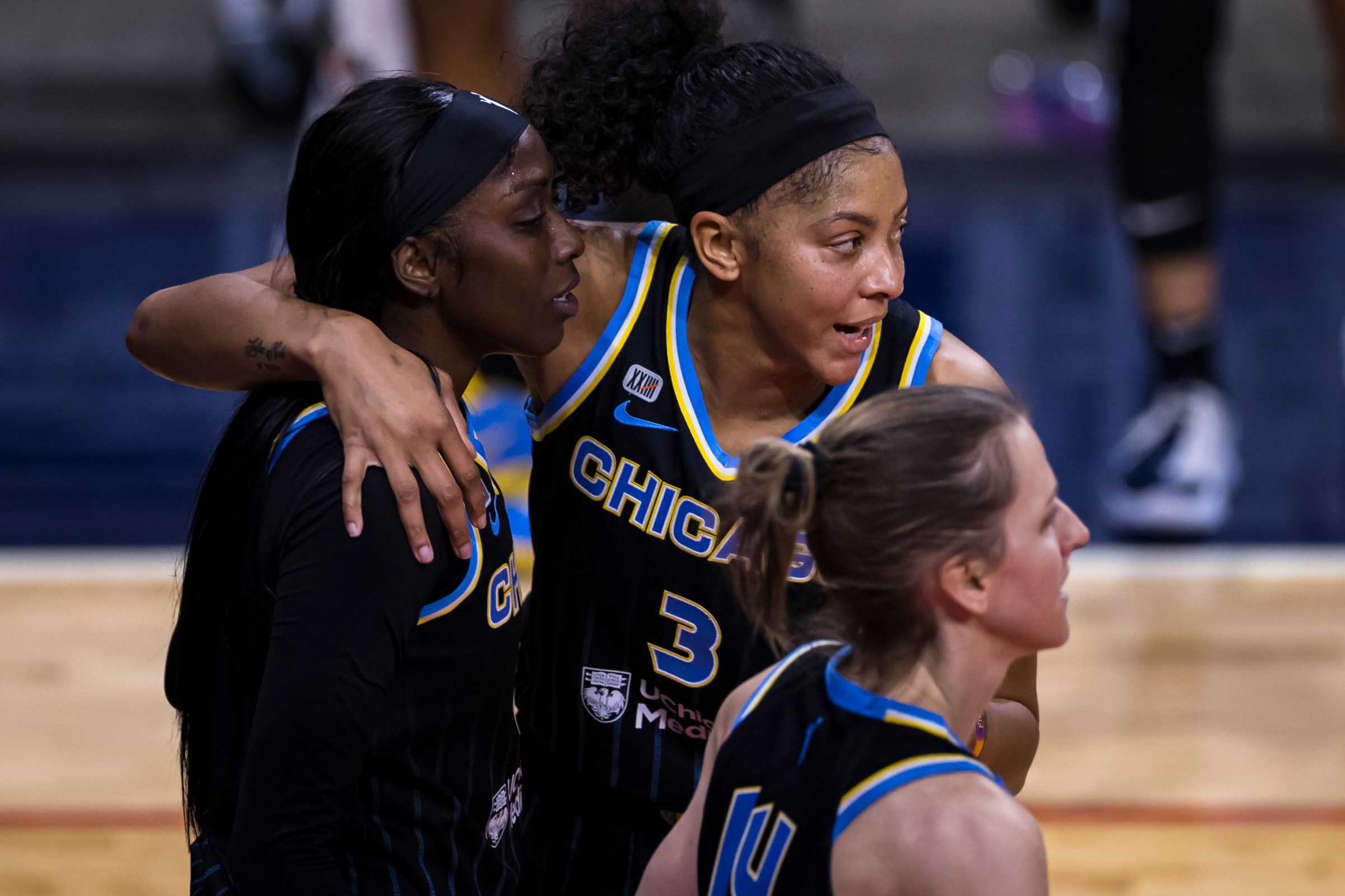 Candace Parker #3 of the Chicago Sky huddles with teammates Kahleah Copper #2 and Allie Quigley #14 during the first half of the game against the Washington Mystics at Entertainment &amp; Sports Arena on May 15, 2021 in Washington, DC.