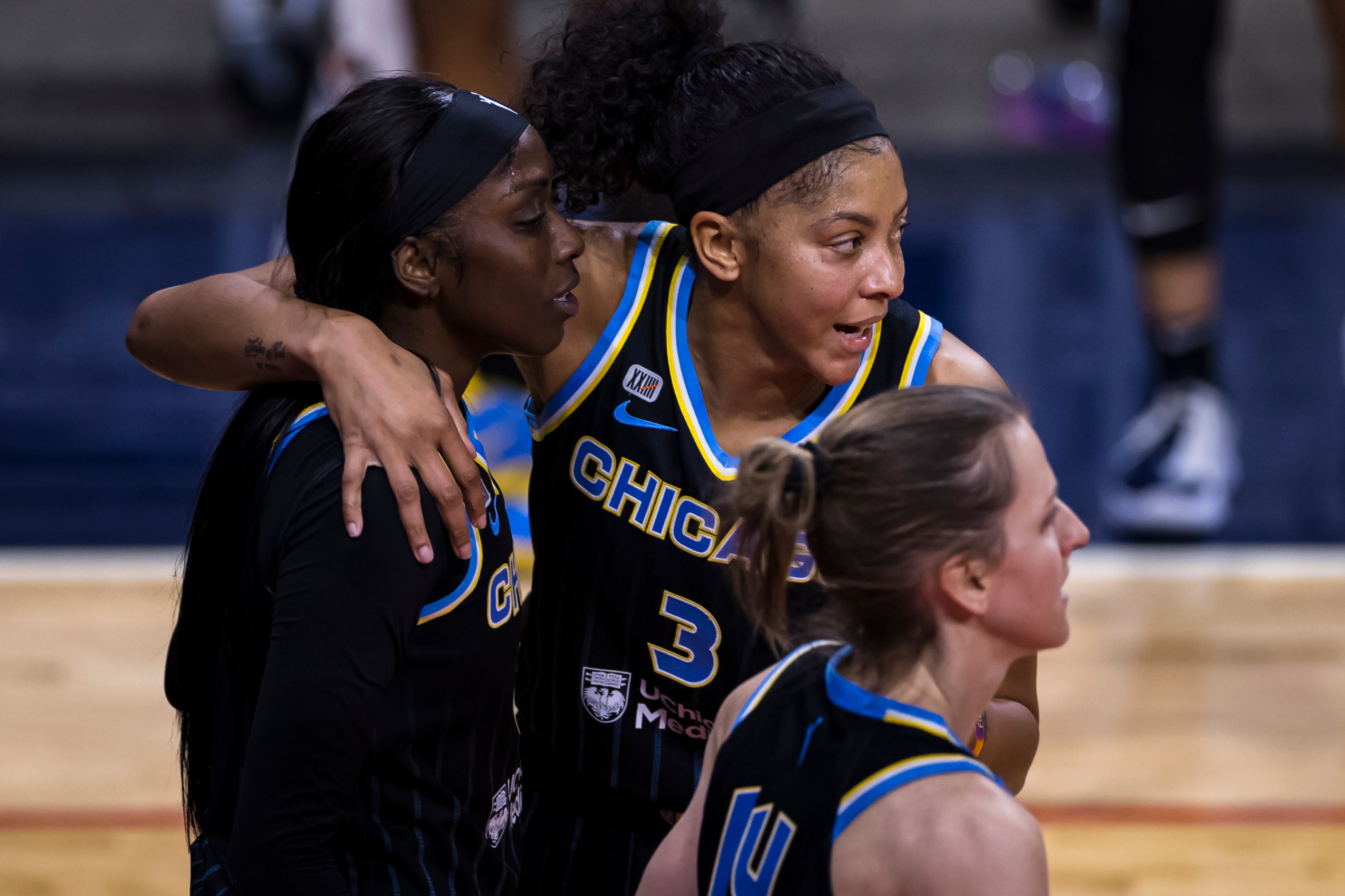 Candace Parker #3 of the Chicago Sky huddles with teammates Kahleah Copper #2 and Allie Quigley #14 during the first half of the game against the Washington Mystics at Entertainment & Sports Arena on May 15, 2021 in Washington, DC.